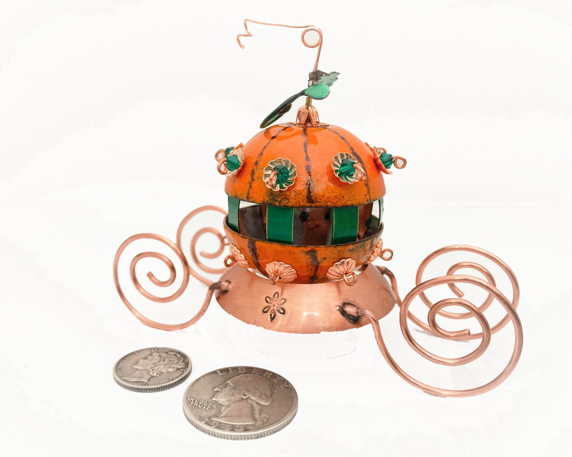 miniature pumpkin carriage made of copper enamel and copper wire showing size related to dime and quarter