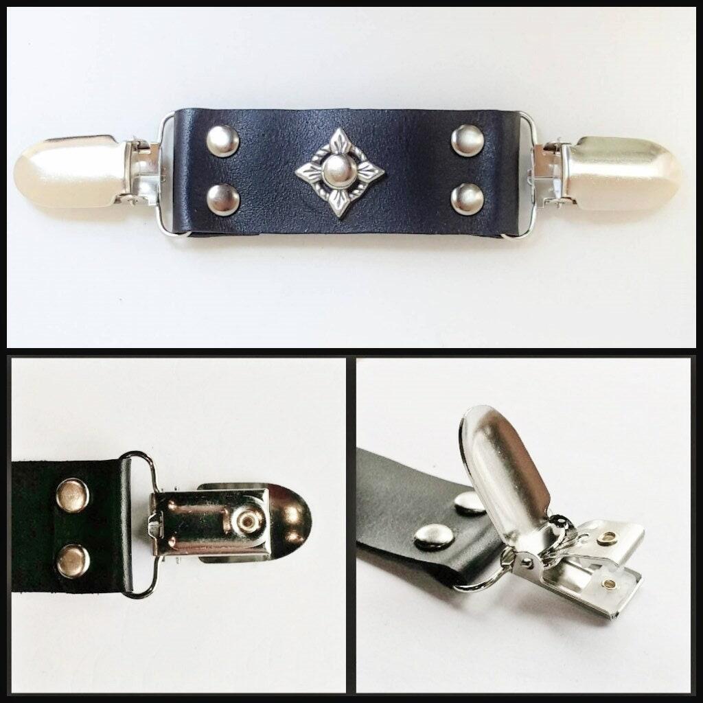 Black leather cinch clip with silver tone clips & o-ring. Shirt