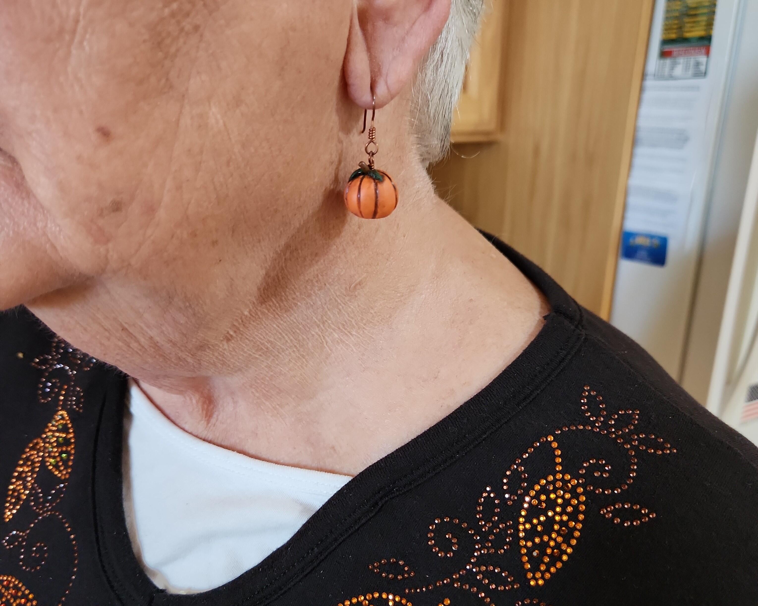 Polymer Clay Pumpkin Copper Earrings in use