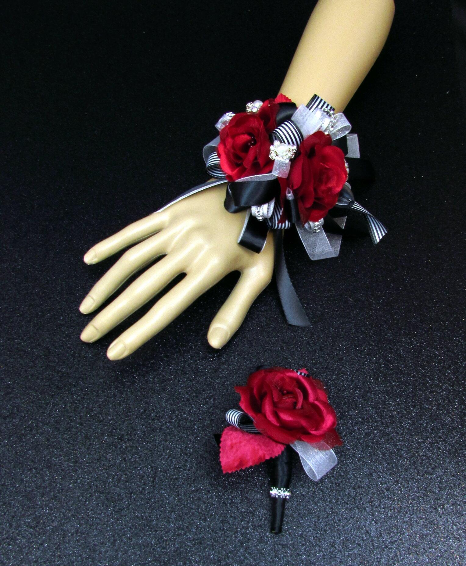 This petite red rose wrist corsage comes with a keepsake bracelet.