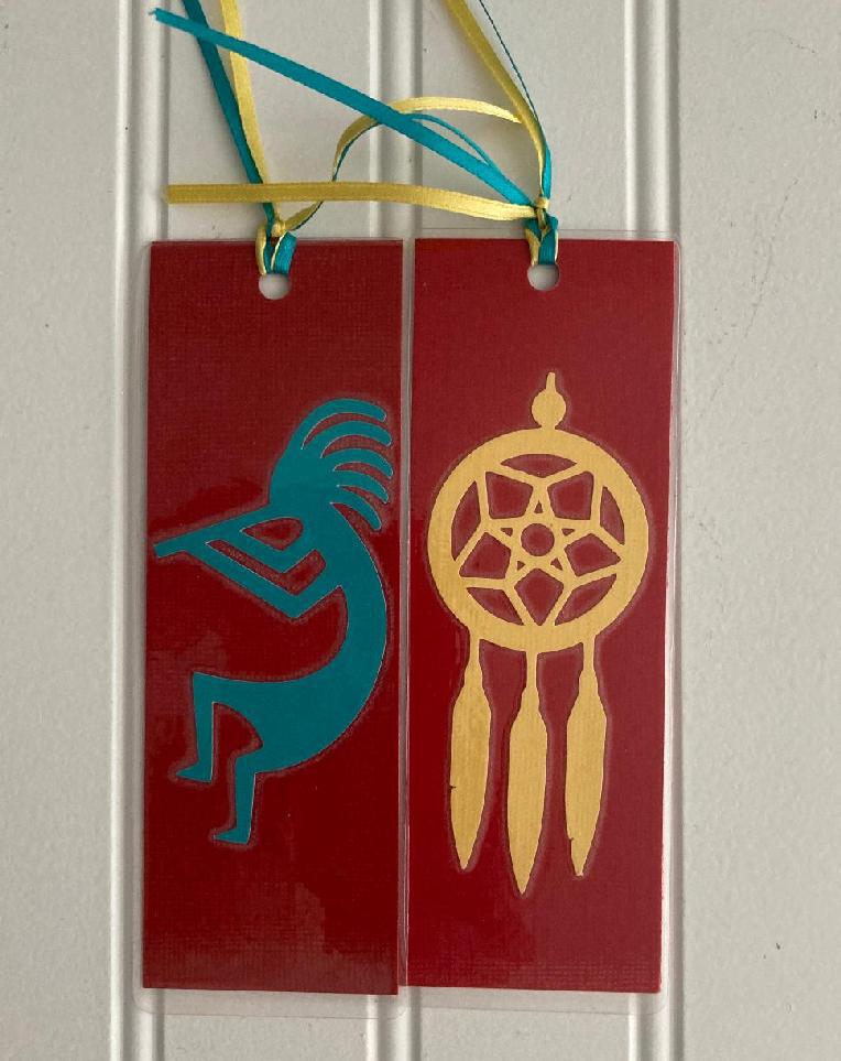 Kokopelli Native American Indians bookmark with dreamer weave and kokopelli dancing on front and  dteamer weaver on opposite side. Clef  double sized Measurents: 2.25" W x 6:" Lbookmark. Made of cardstock and laminated 
Measurents: 2.25" W x 6:" L