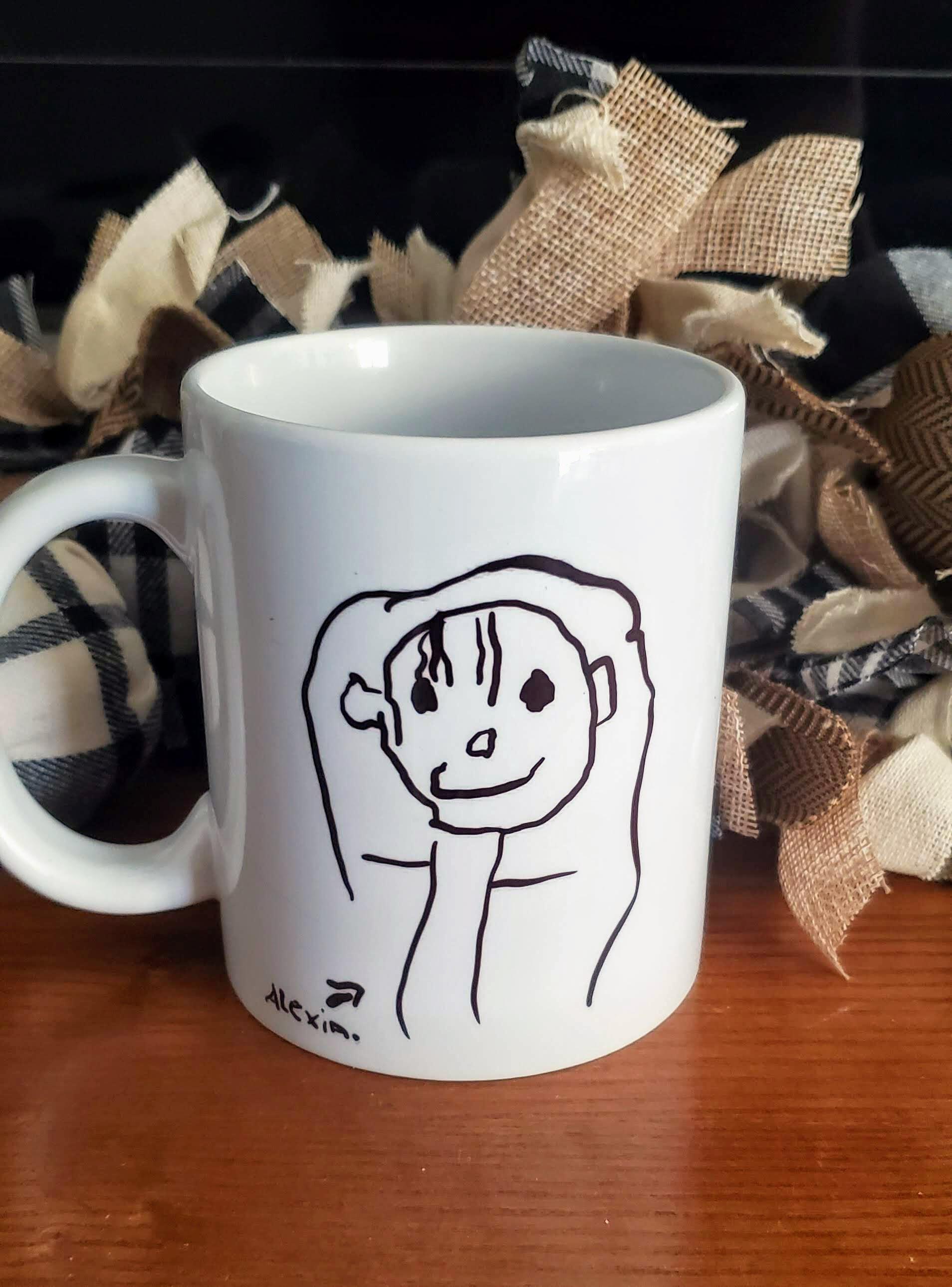 mug with kid stick figure of a girl.