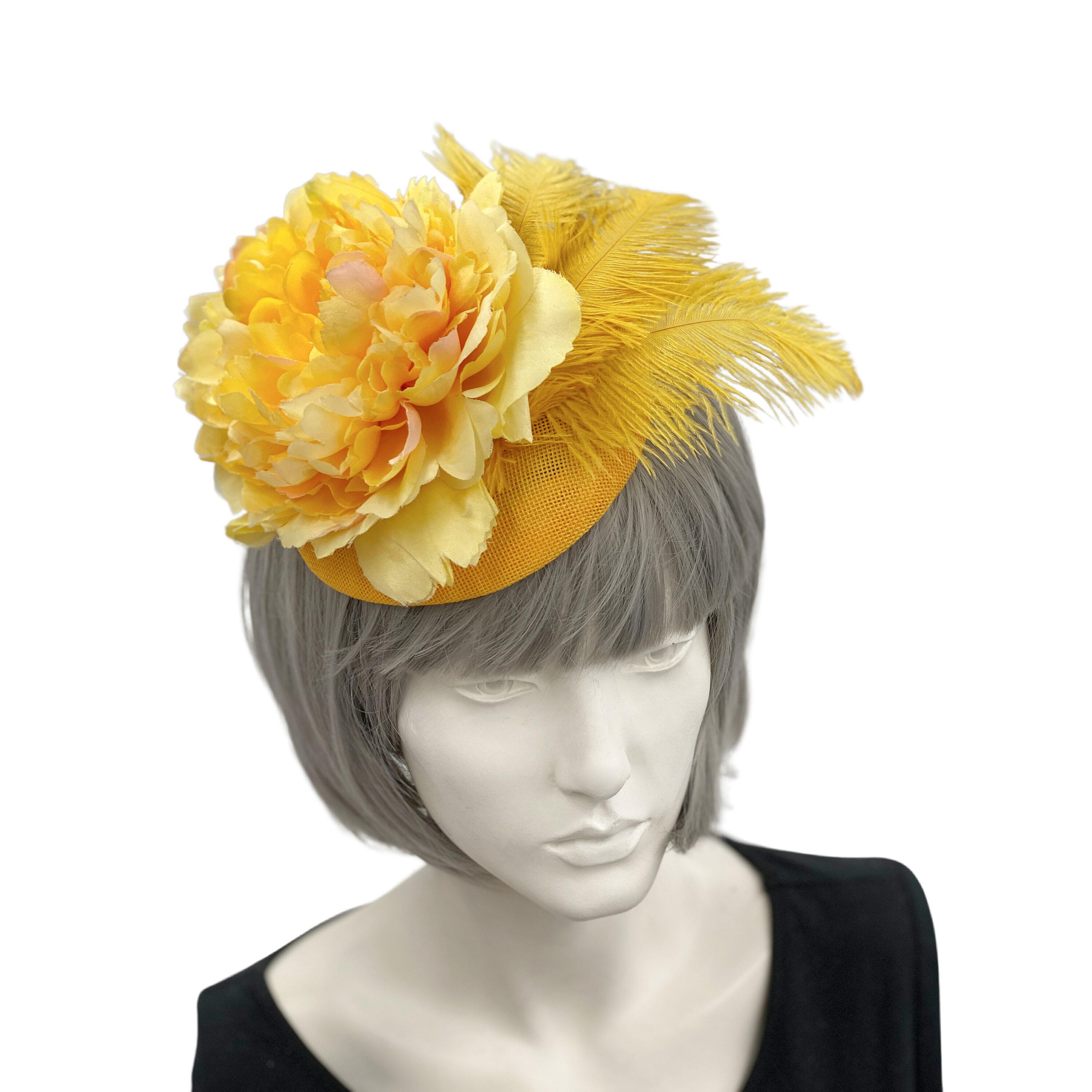 Yellow fascinator store with loops, flower and red arrow feathers. Made to order!