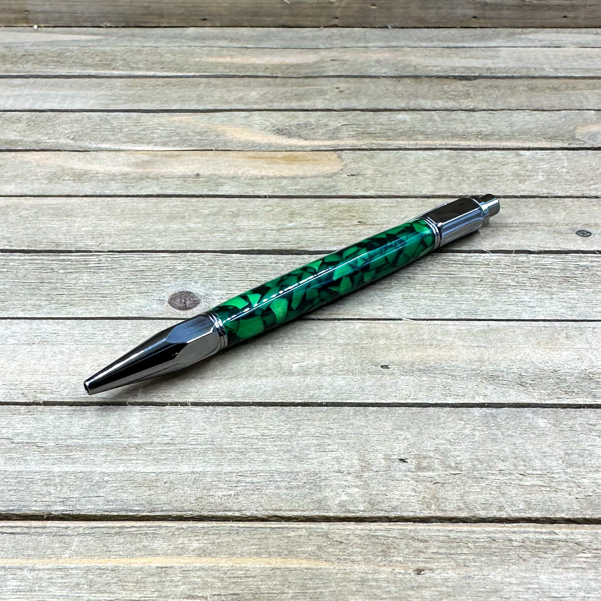 Custom pen turned from mystic green acrylic blank set with Celtic style twist pen 2024 body. Black ink medium point replaceable cartridge