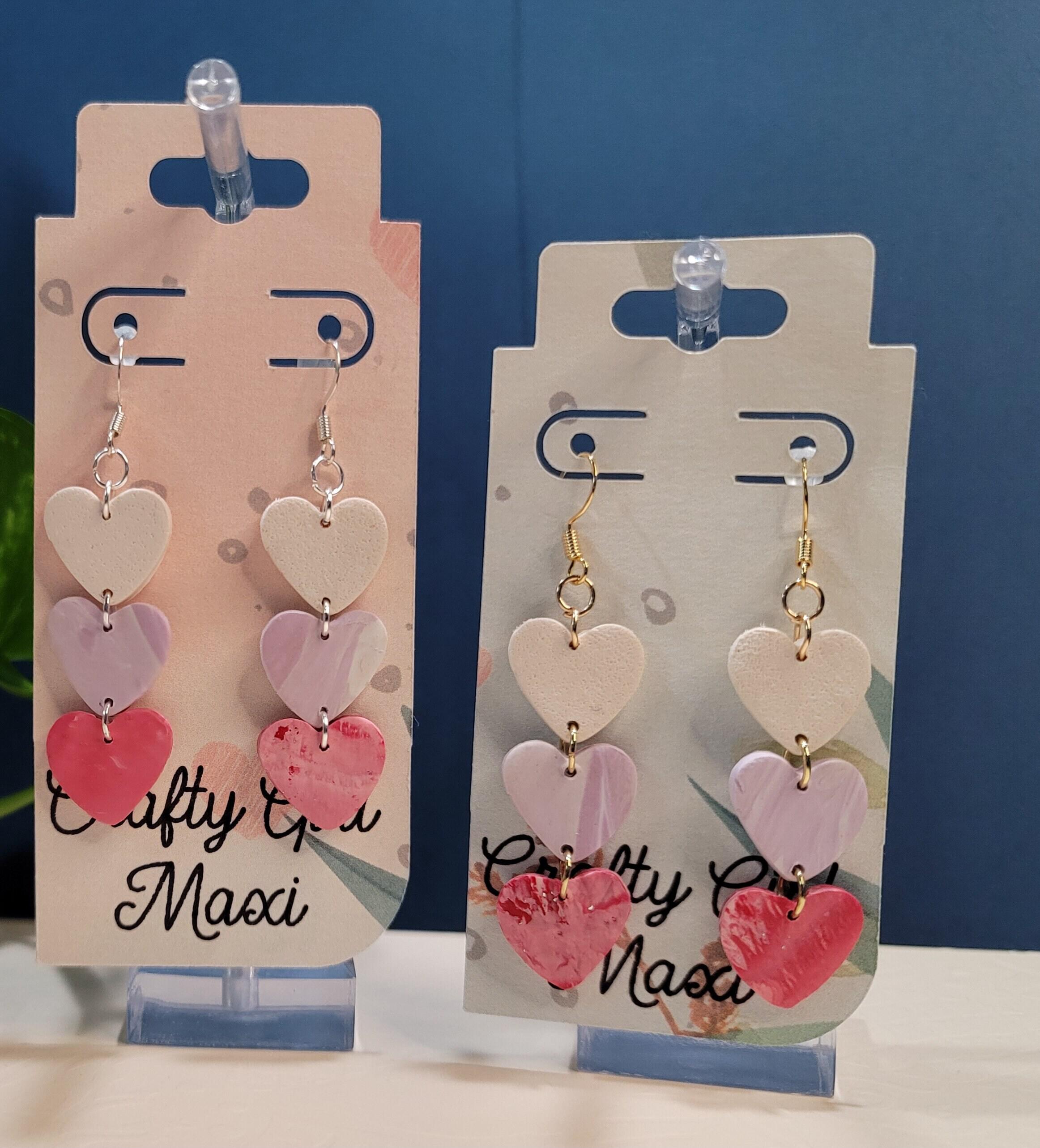 Heart polymer clay earrings. Lightweight earrings. Made in a modern clay  earring designs. Hoops,accent beads, and hearts make a great gift.