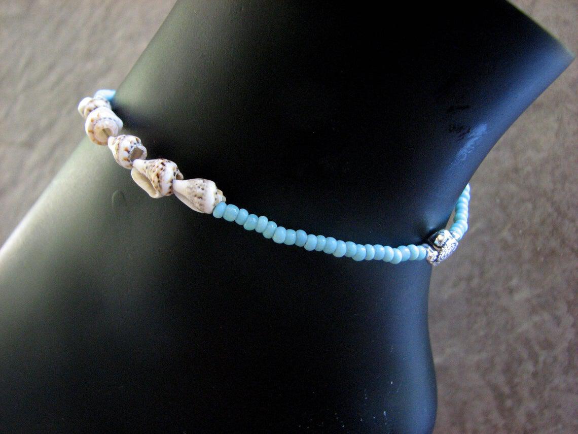 This dainty blue bead anklet adds a touch of ocean flair to everything you wear