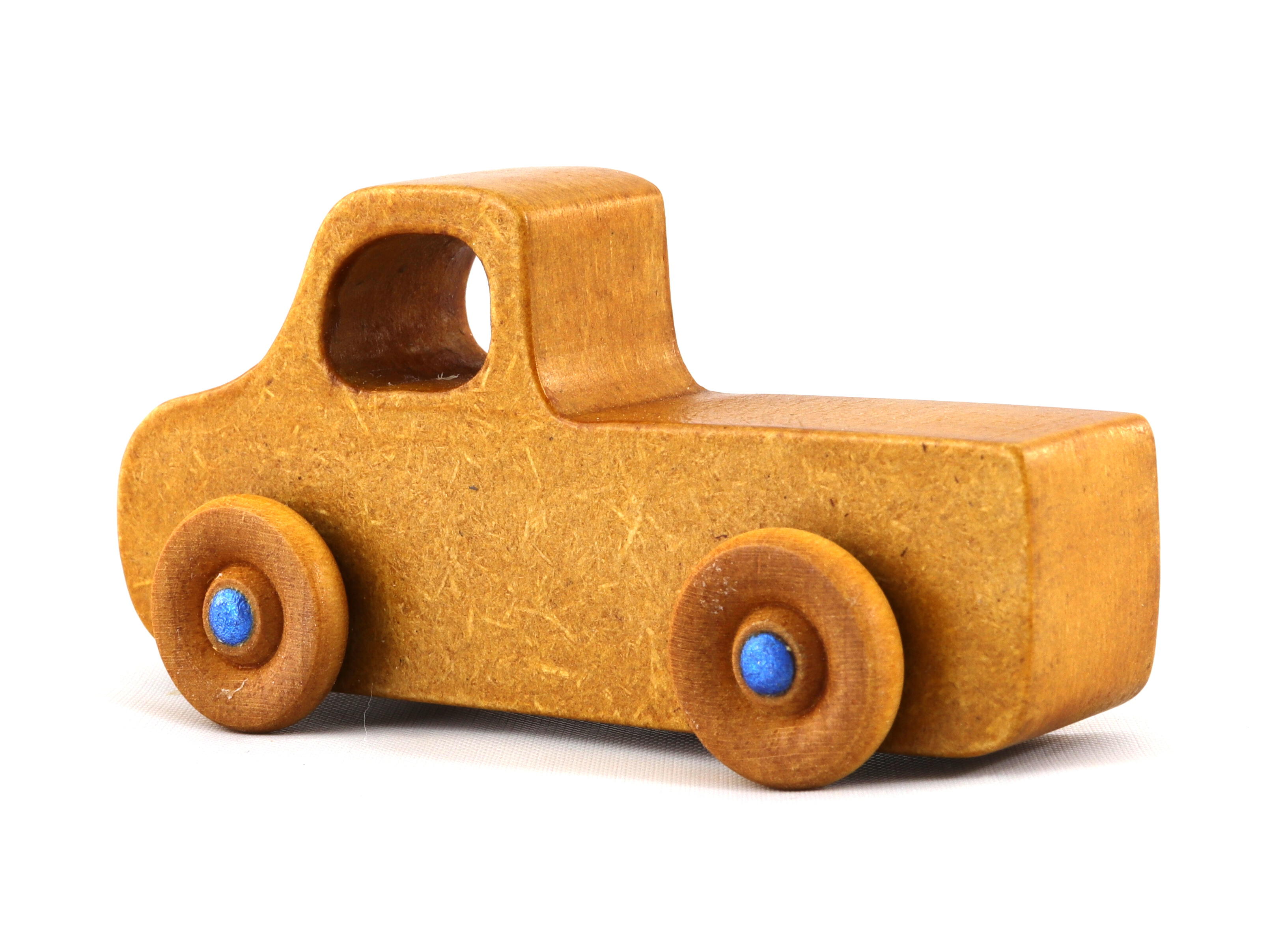 This handmade toy pickup truck from My Play Pal Collection is finished with amber shellac and metallic sapphire blue acrylic paint. It is just one of many unique wooden vehicles available.