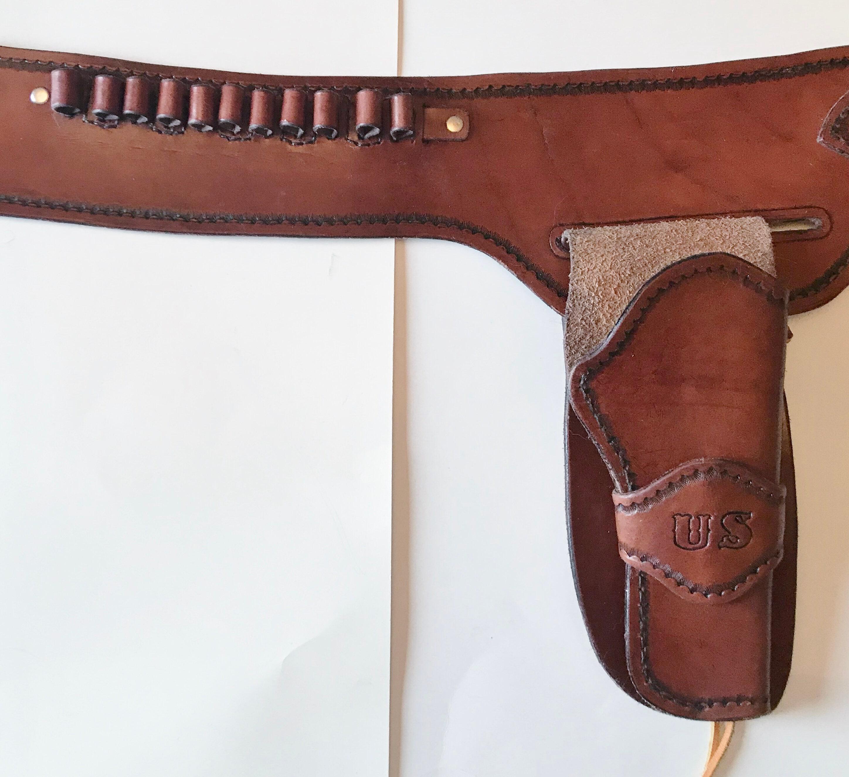 Hand tooled western style leather holster and belt