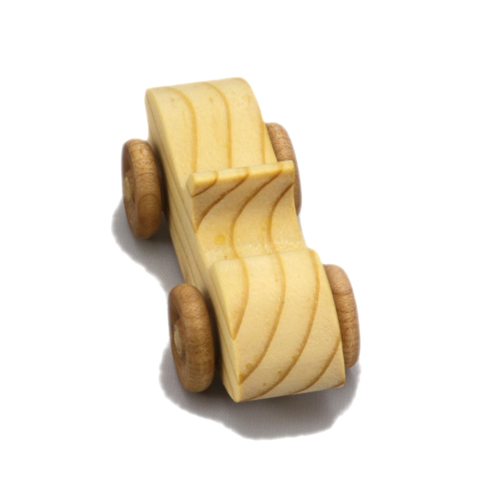 A small handmade wooden toy car hand-finished with a custom blend of mineral oil and waxes.