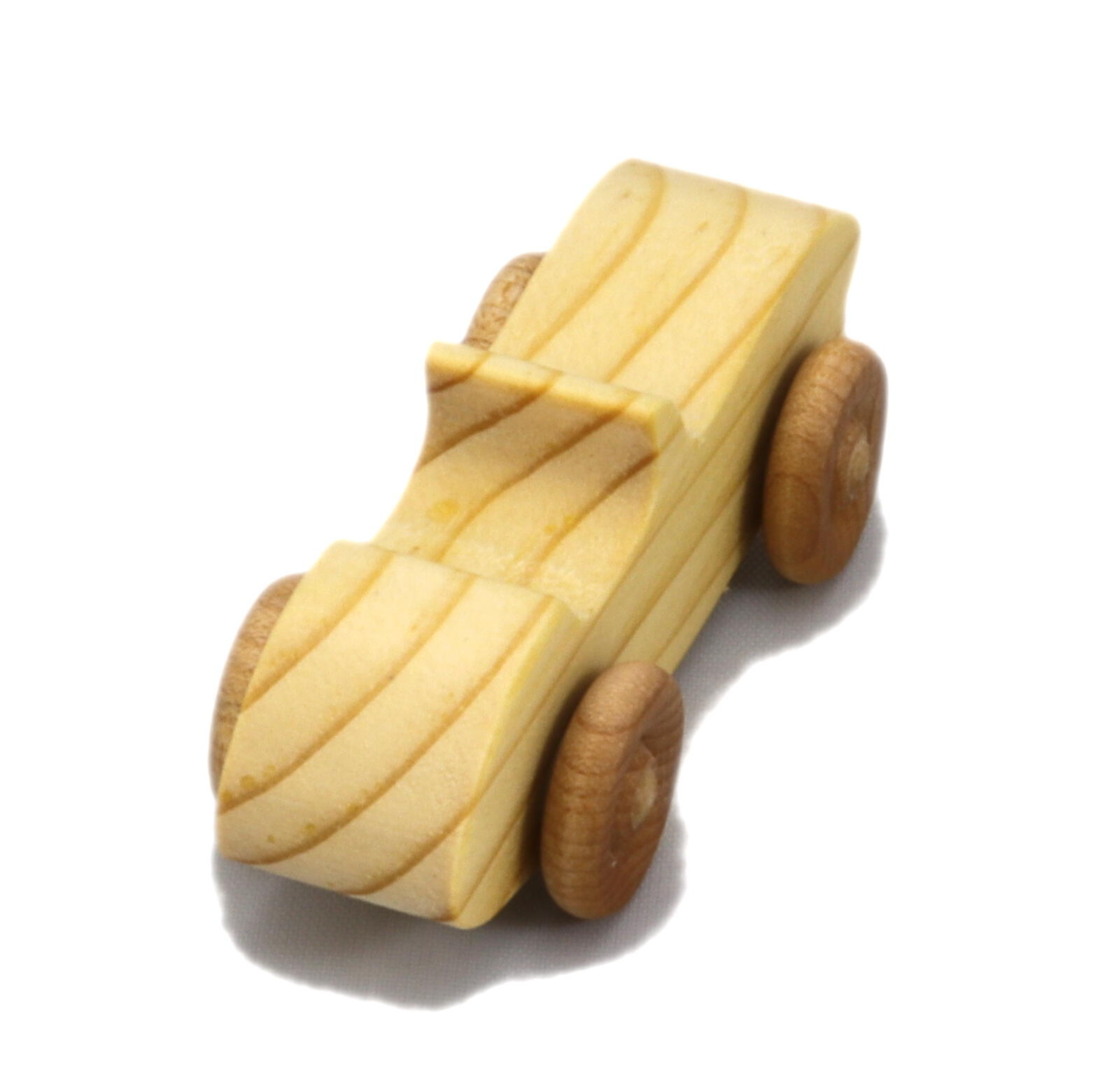 A small handmade wooden toy car hand-finished with a custom blend of mineral oil and waxes.