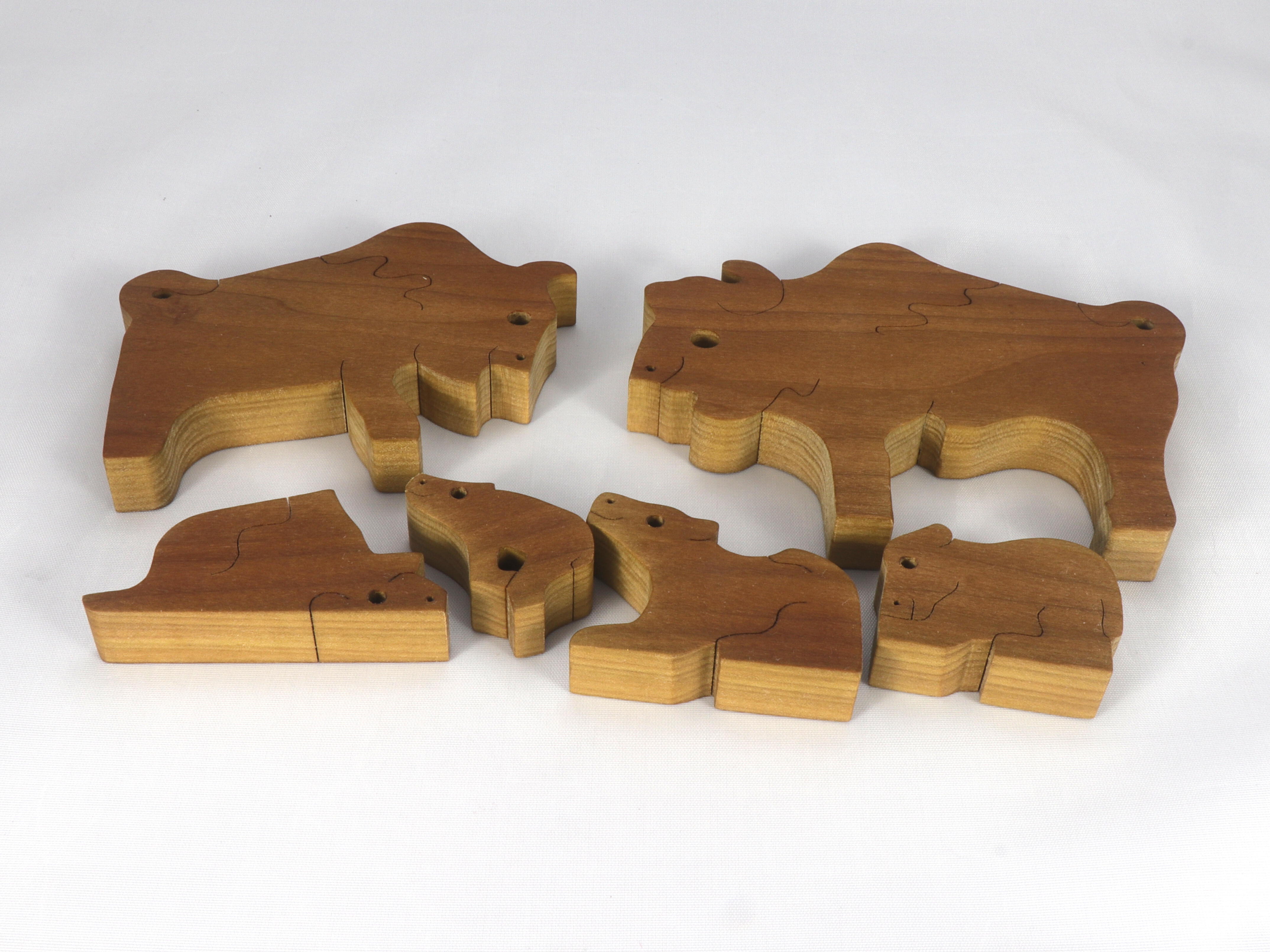 Handmade freestanding buffalo family stacking puzzle made of select-grade hardwoods. Finished with a blend of mineral oil, beeswax, and carnauba wax.