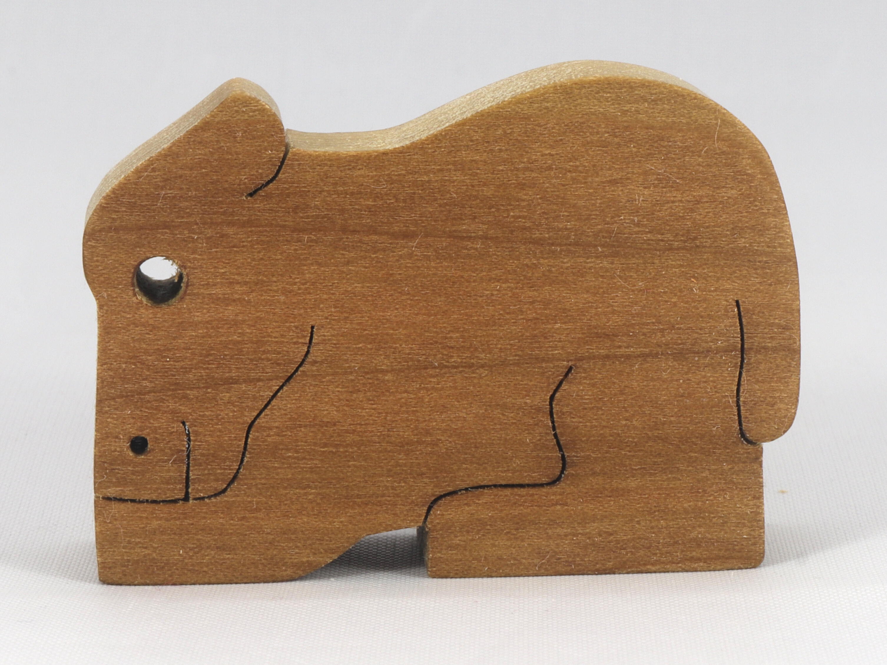 Handmade freestanding buffalo family stacking puzzle made of select-grade hardwoods. Finished with a blend of mineral oil, beeswax, and carnauba wax.