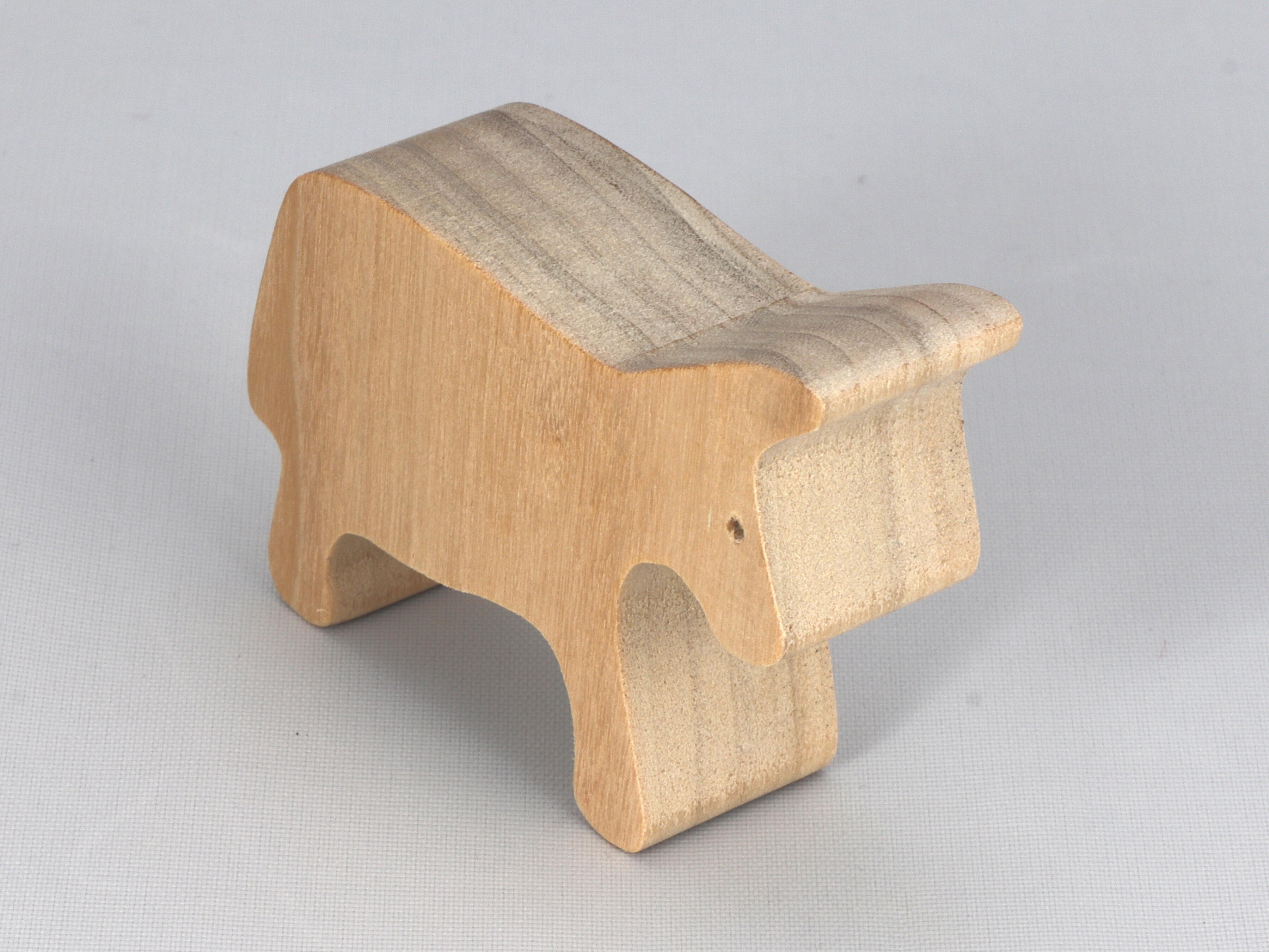 A handmade and unfinished wooden toy cow cutout is perfect for those who love to paint and customize their toys. It is freestanding and stackable, making it a versatile addition to any playroom or nursery. From My Itty Bitty Animal Collection.