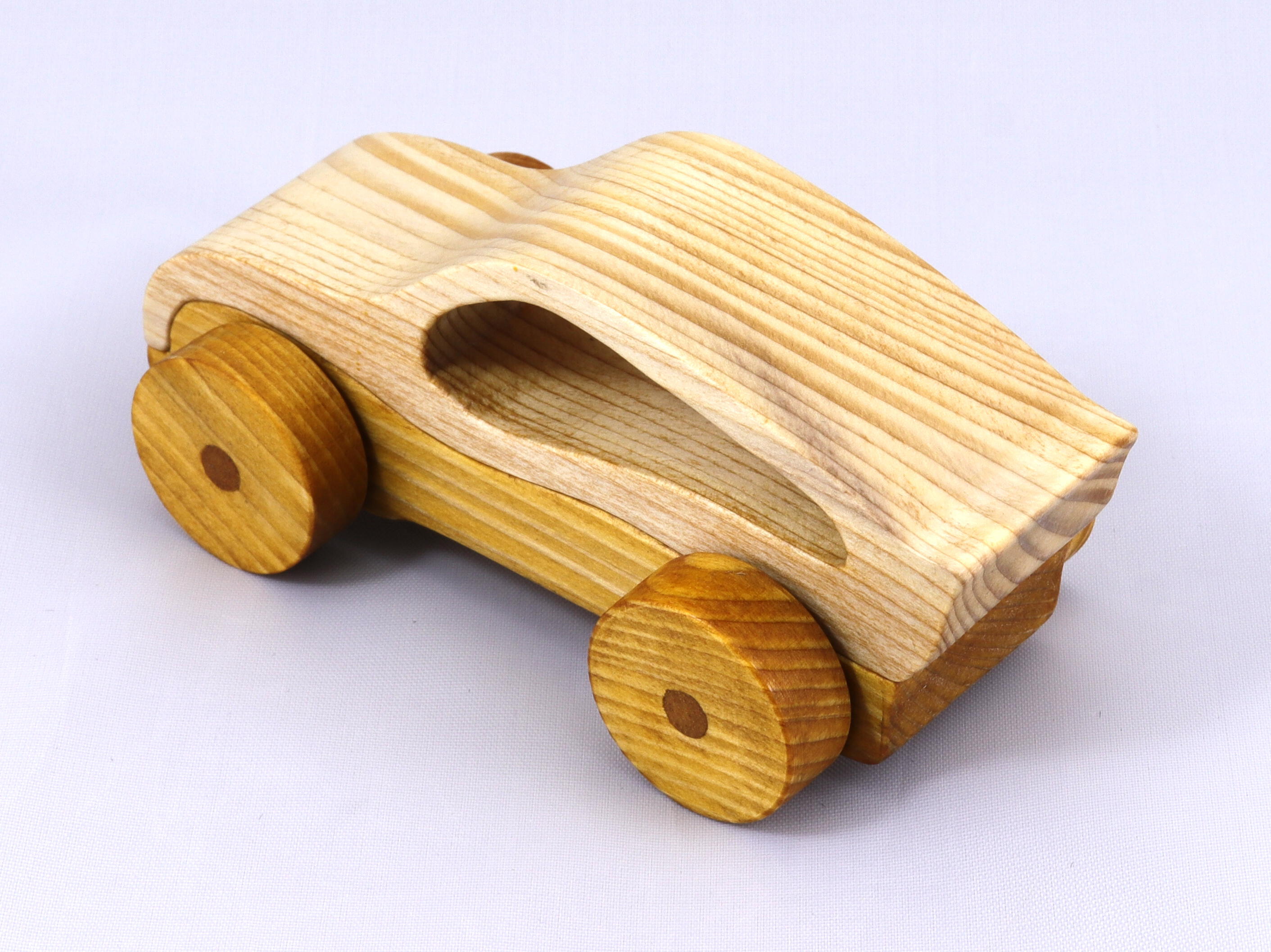 Handmade wooden toy car, two-tone clear and amber shellac finish. Part of my Speedy Wheels Collection.