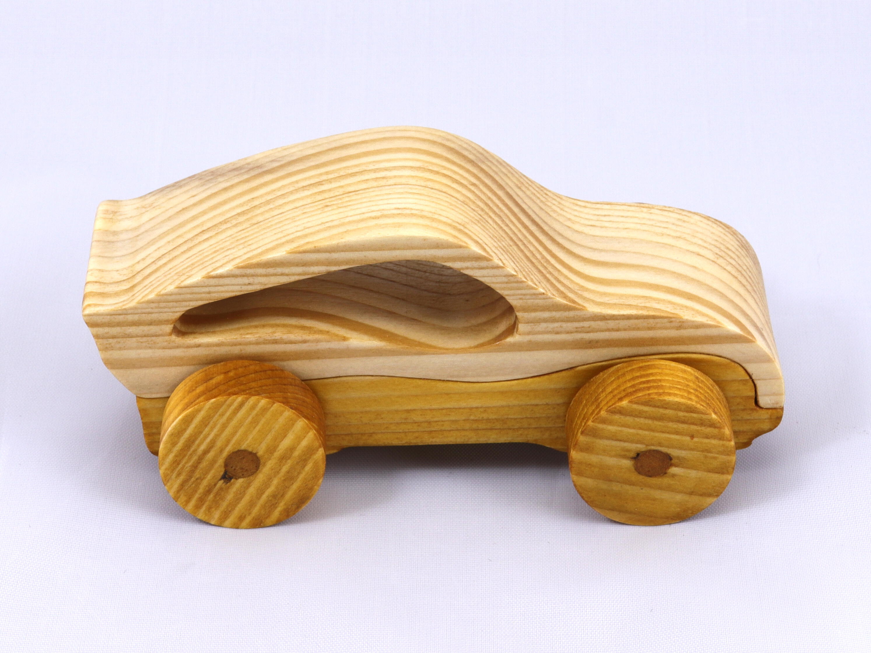 Handmade wooden toy car, two-tone clear and amber shellac finish. Part of my Speedy Wheels Collection.
