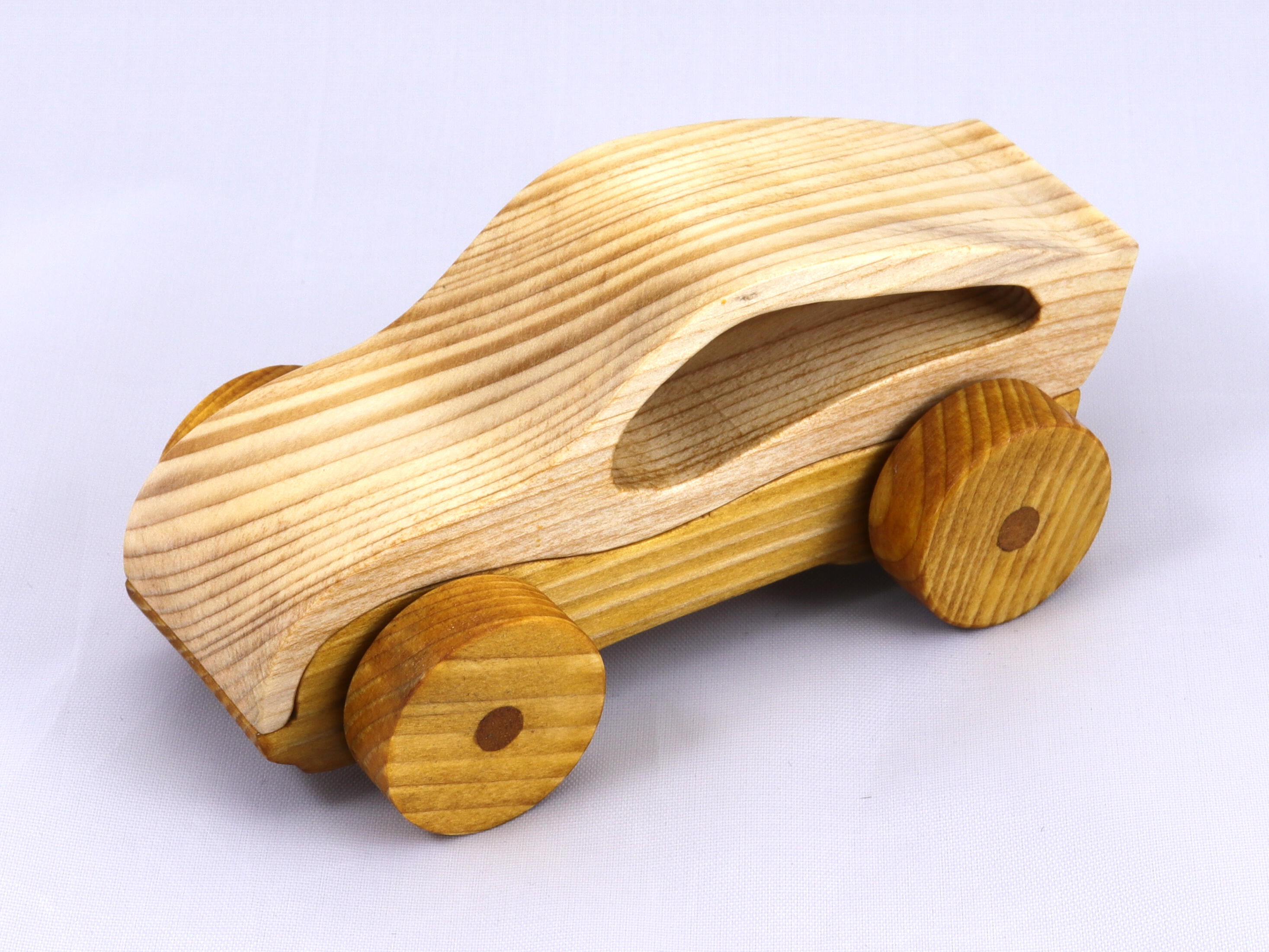 Handmade wooden toy car, two-tone clear and amber shellac finish. Part of my Speedy Wheels Collection.
