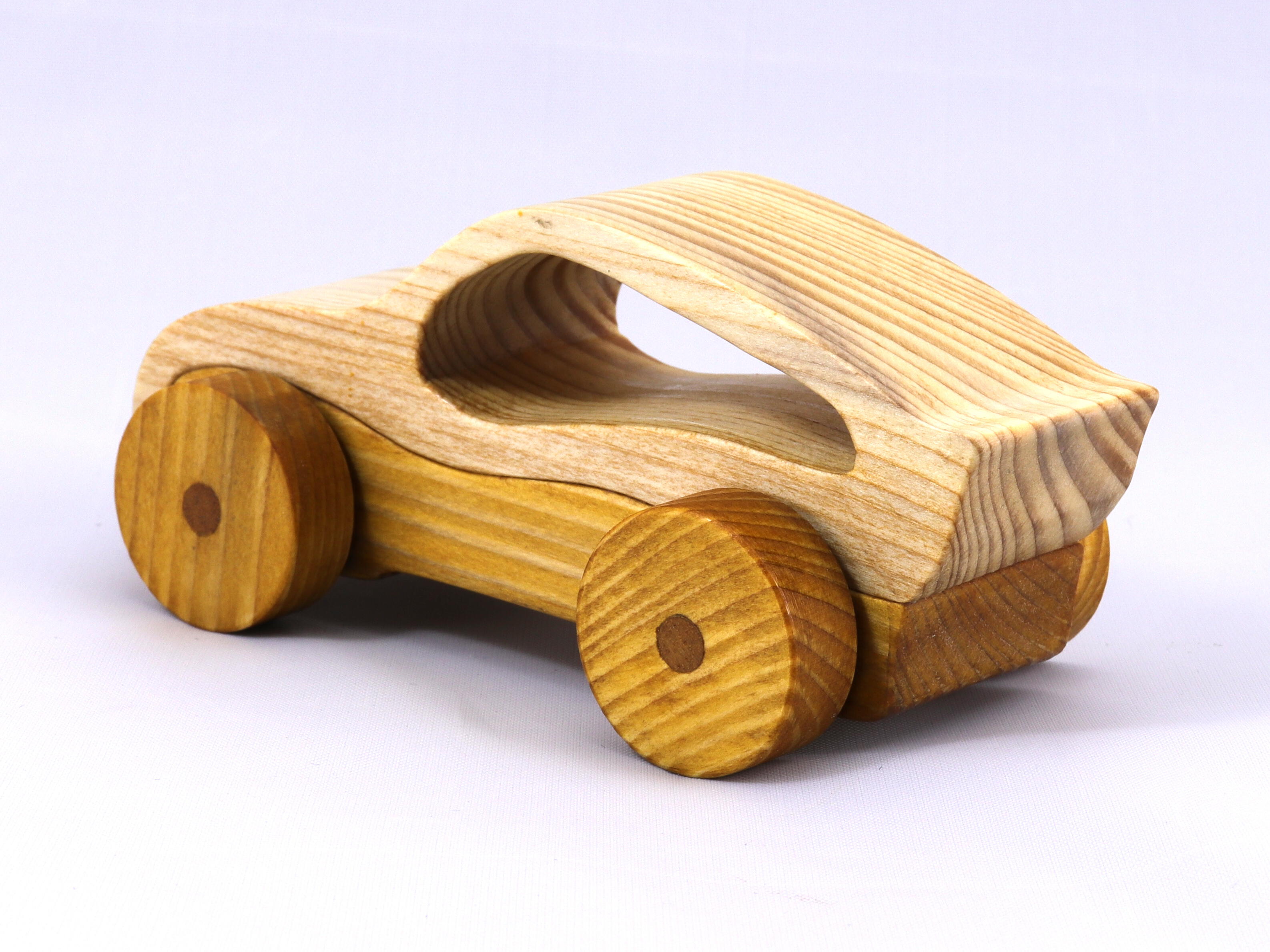 Handmade wooden toy car, two-tone clear and amber shellac finish. Part of my Speedy Wheels Collection.