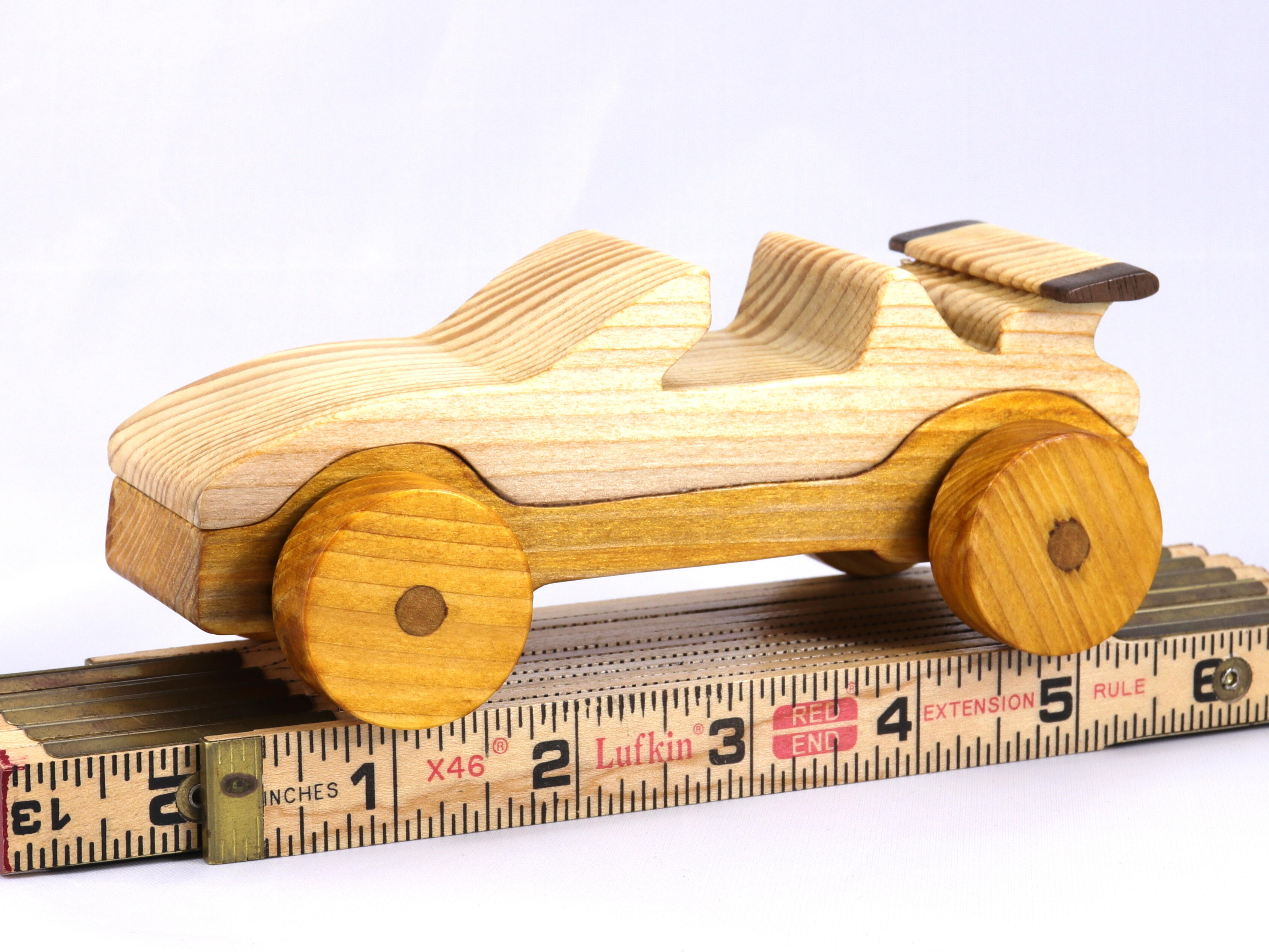 Handmade wooden toy car convertible finished with two-tone clear and amber shellac, one of ten cars in my Speedy Wheels Collection.