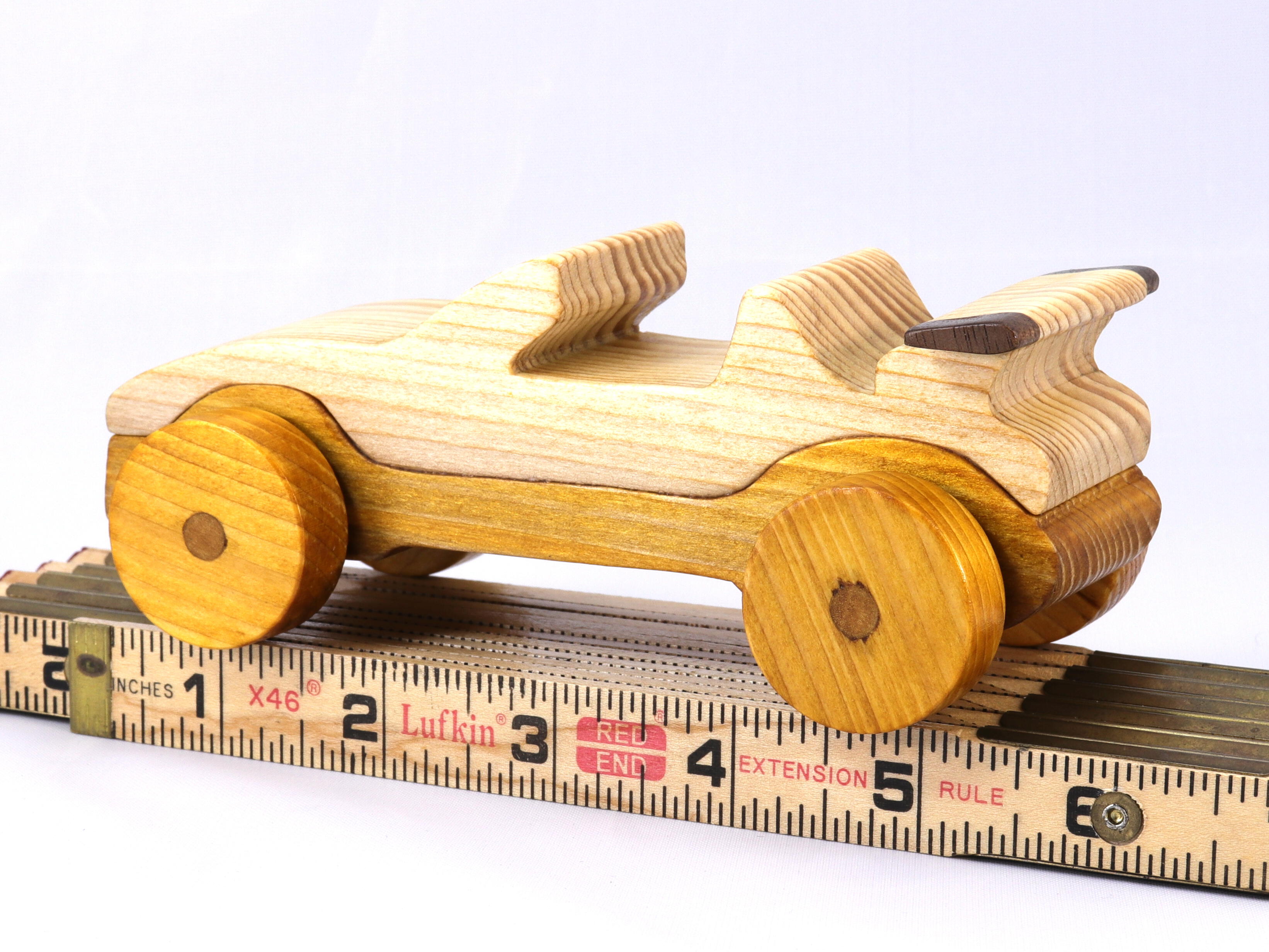Handmade wooden toy car convertible finished with two-tone clear and amber shellac, one of ten cars in my Speedy Wheels Collection.