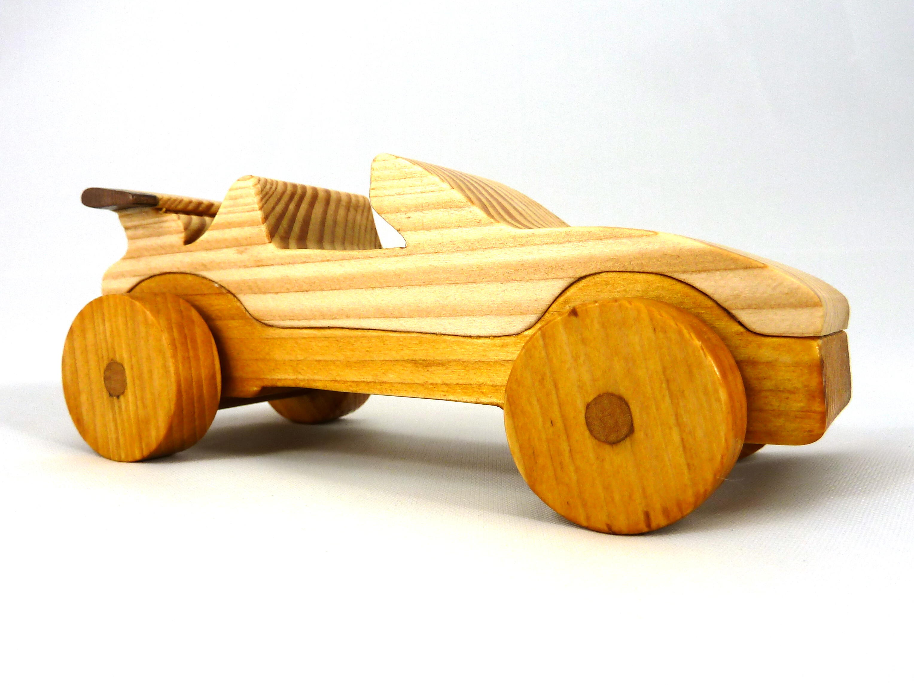 Handmade wooden toy car convertible finished with two-tone clear and amber shellac, one of ten cars in my Speedy Wheels Collection.