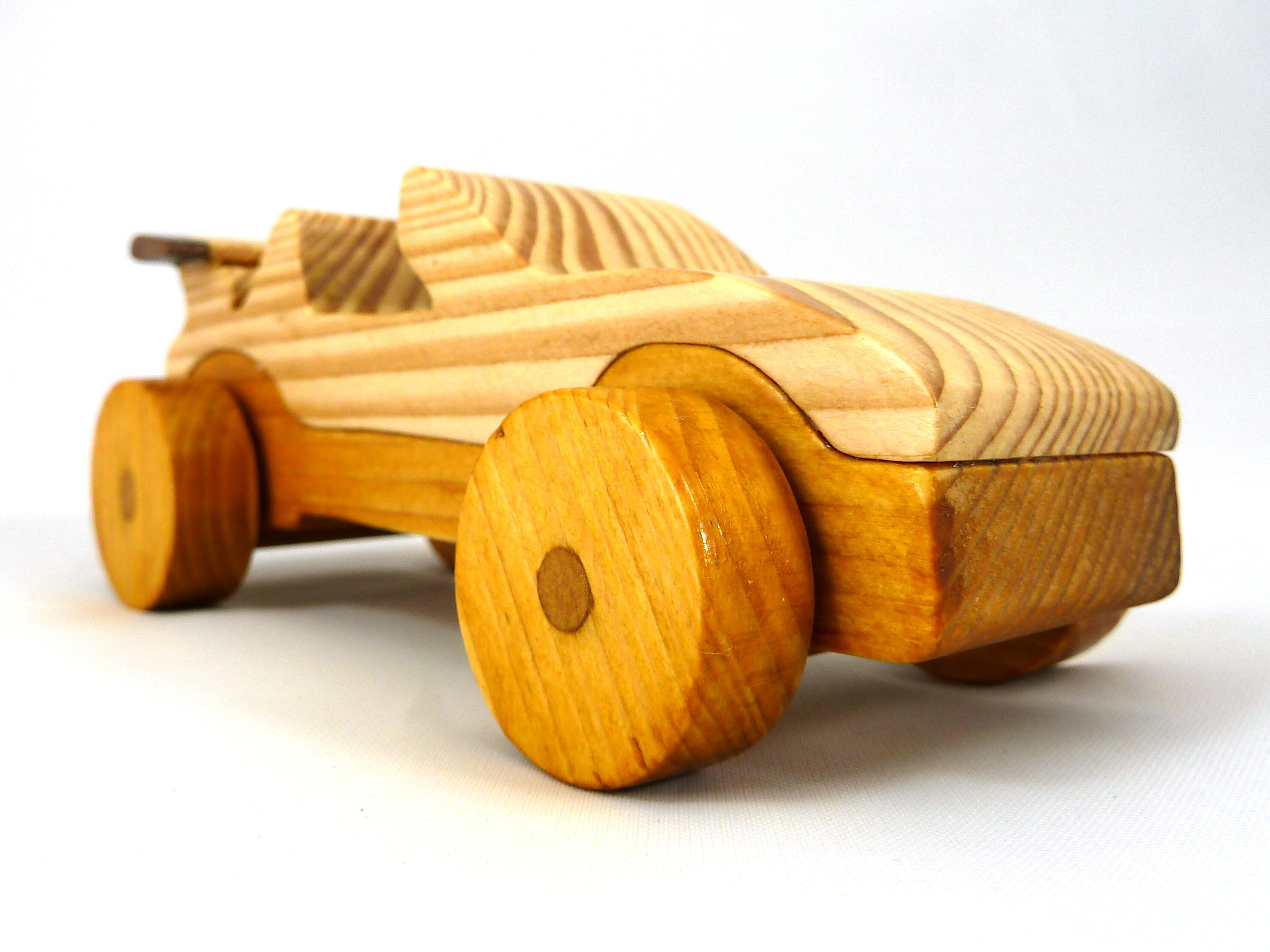Handmade wooden toy car convertible finished with two-tone clear and amber shellac, one of ten cars in my Speedy Wheels Collection.