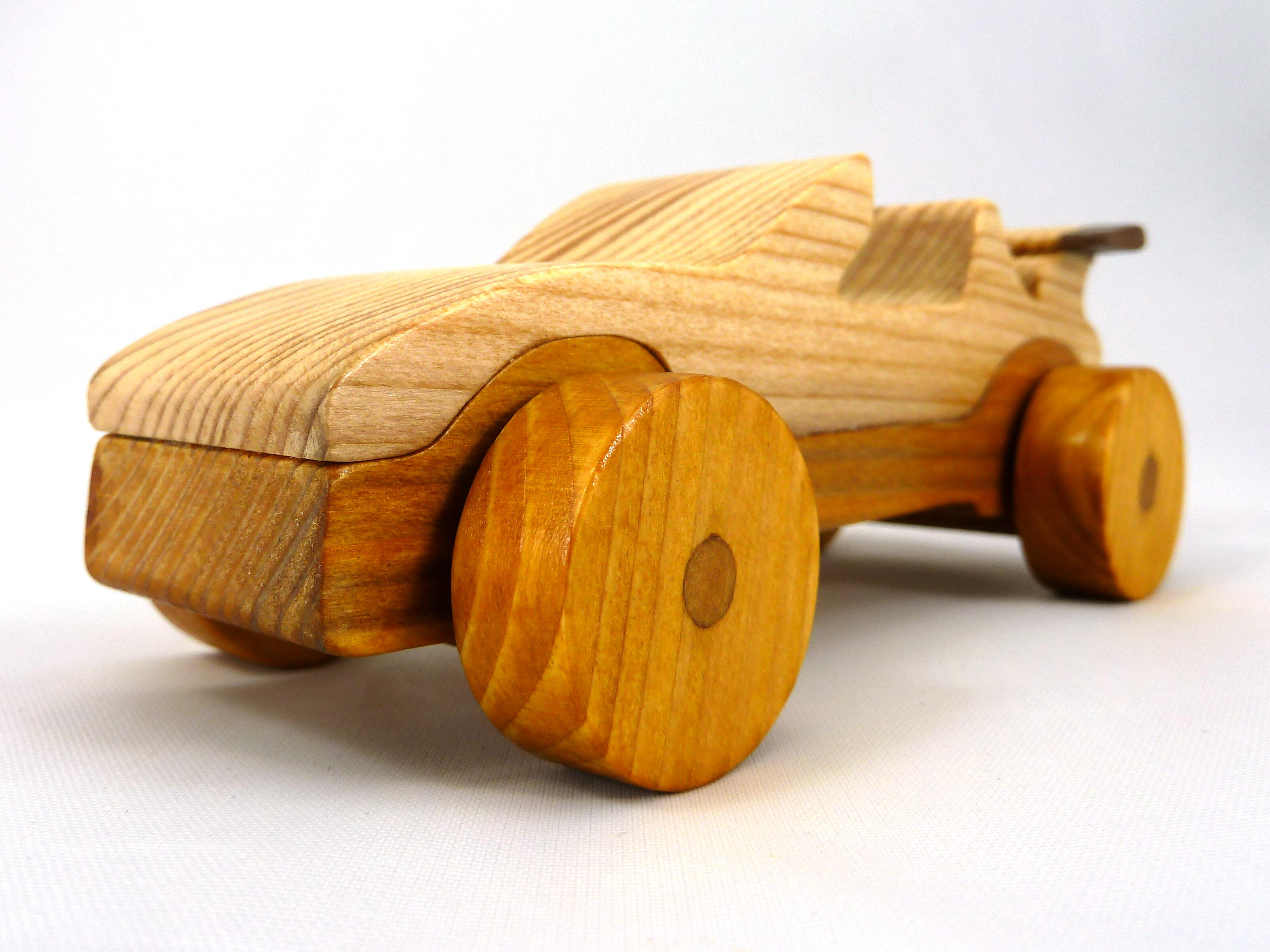 Handmade wooden toy car convertible finished with two-tone clear and amber shellac, one of ten cars in my Speedy Wheels Collection.