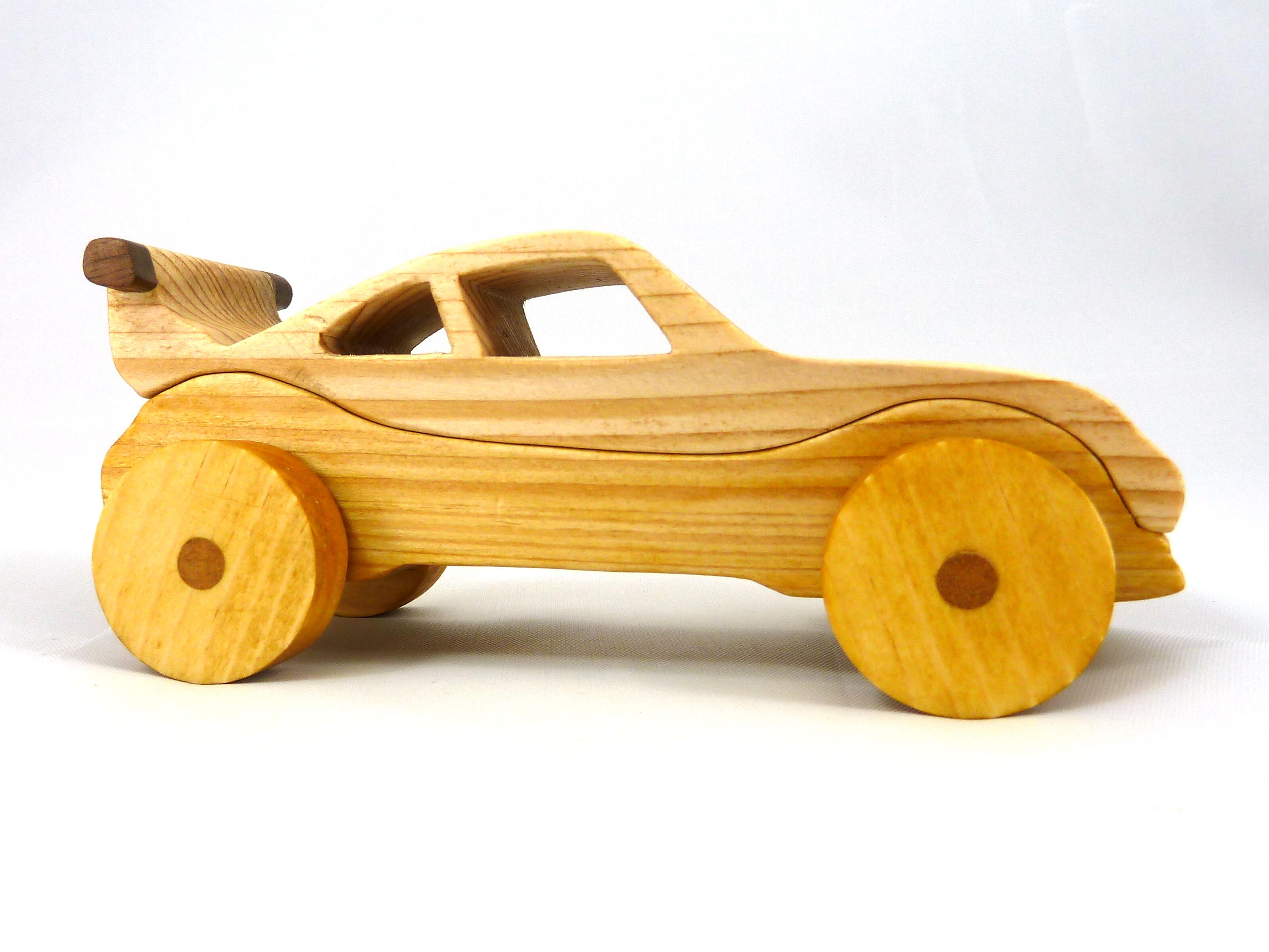 Handmade wooden toy car coupe finished with nontoxic clear, amber shellac and contrasting wood trim. It's one of ten cars in my Speedy Wheels Collection.