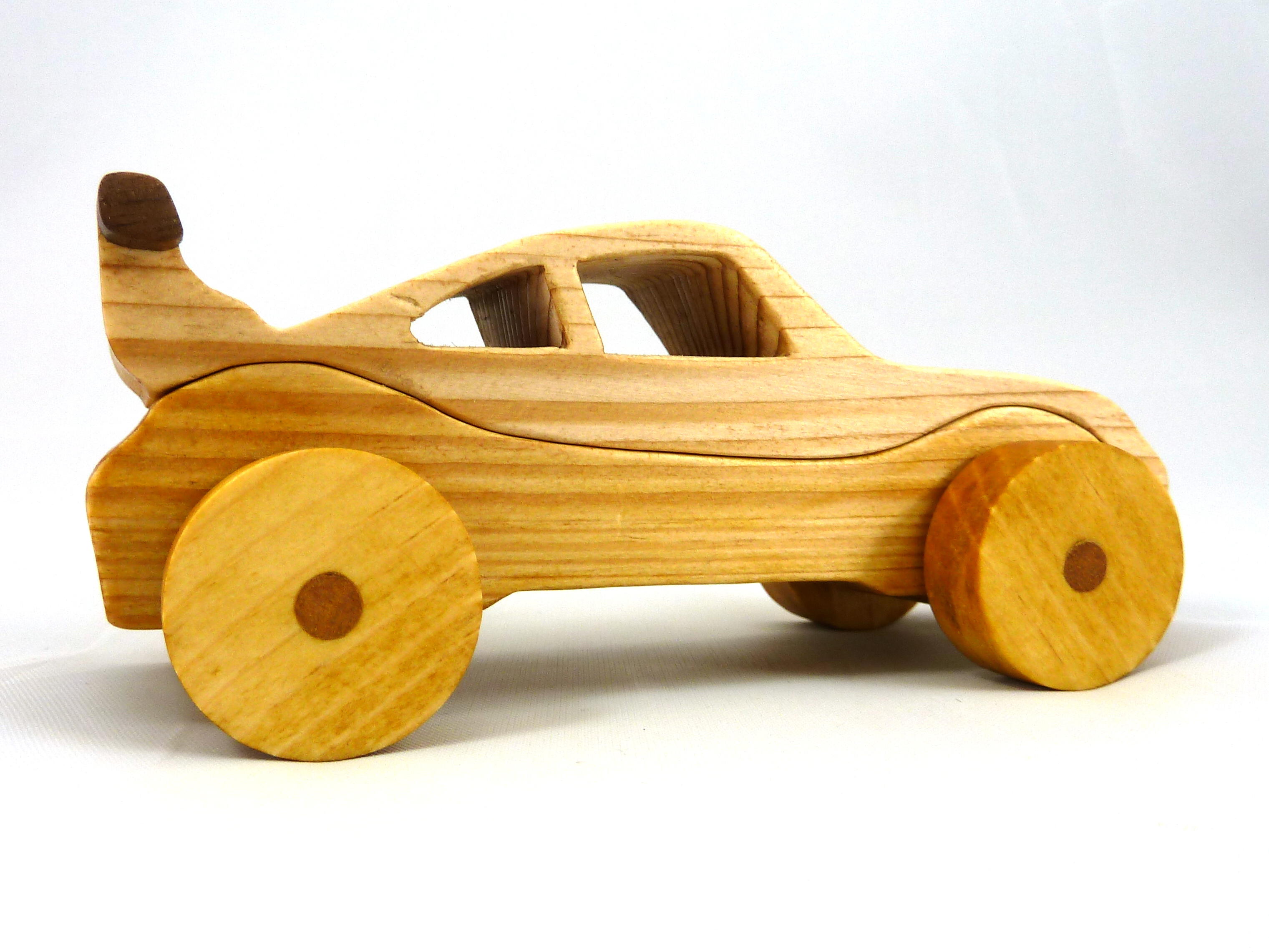 Handmade wooden toy car coupe finished with nontoxic clear, amber shellac and contrasting wood trim. It's one of ten cars in my Speedy Wheels Collection.