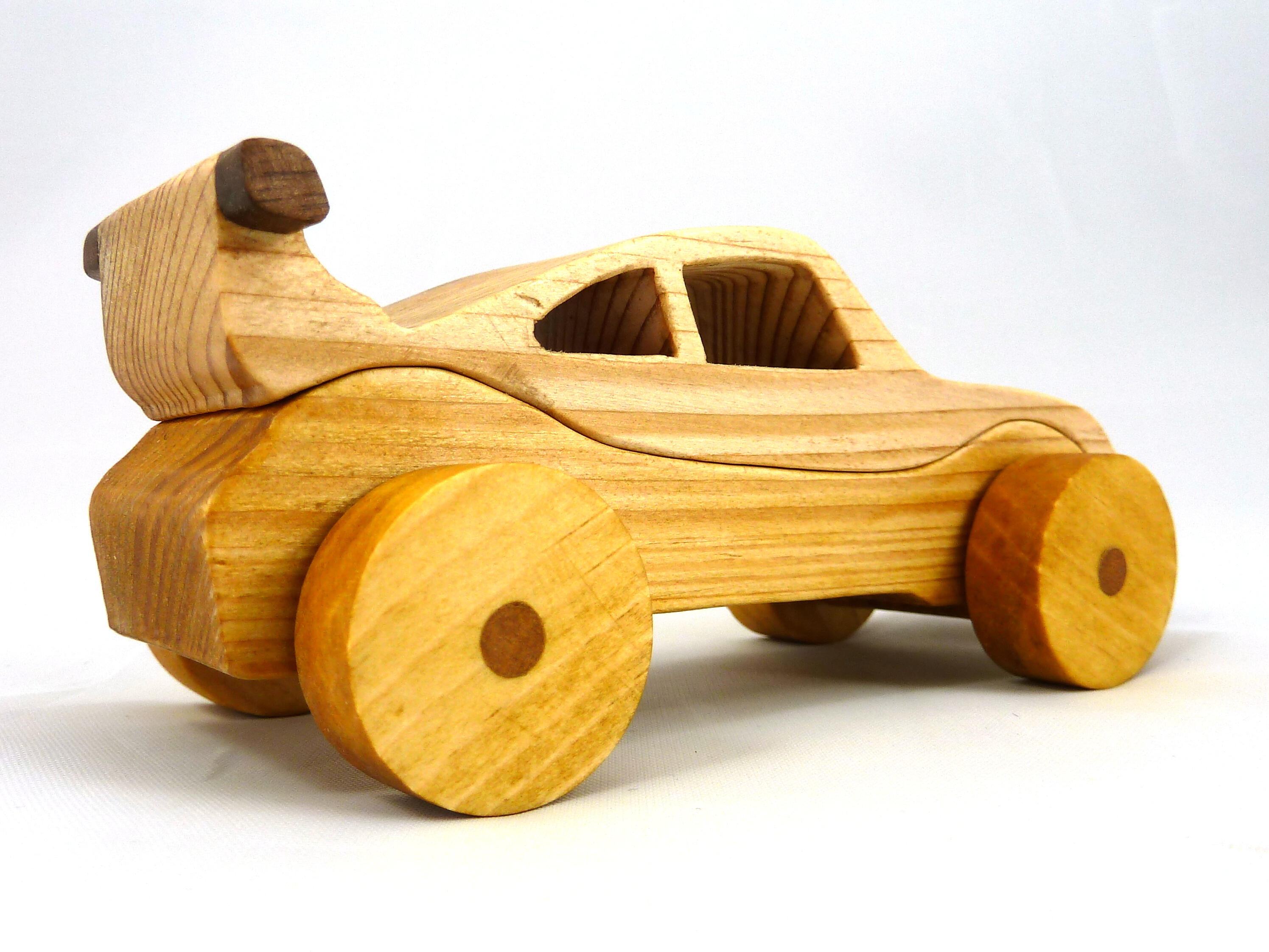 Handmade wooden toy car coupe finished with nontoxic clear, amber shellac and contrasting wood trim. It's one of ten cars in my Speedy Wheels Collection.