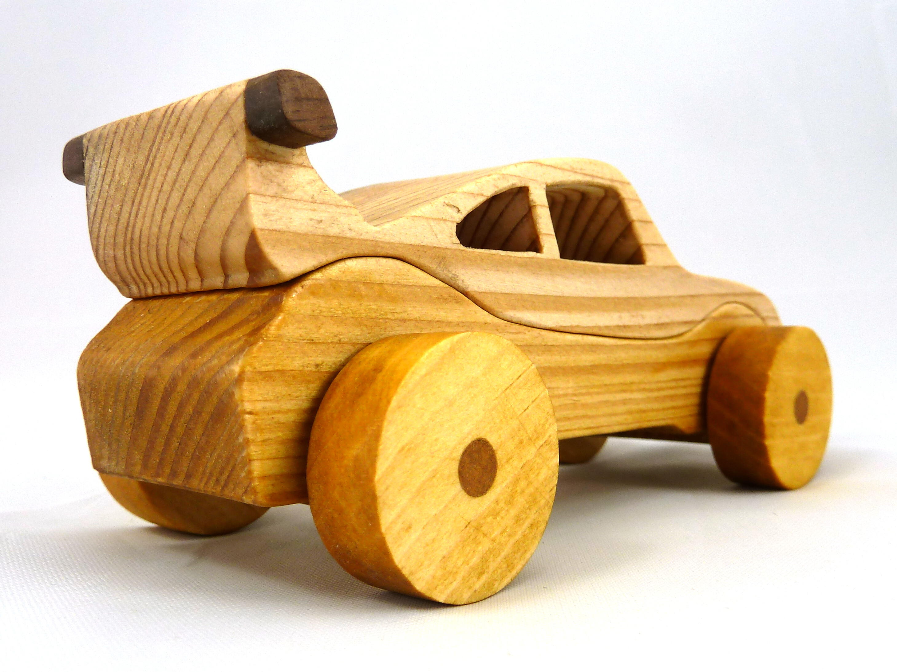 Handmade wooden toy car coupe finished with nontoxic clear, amber shellac and contrasting wood trim. It's one of ten cars in my Speedy Wheels Collection.