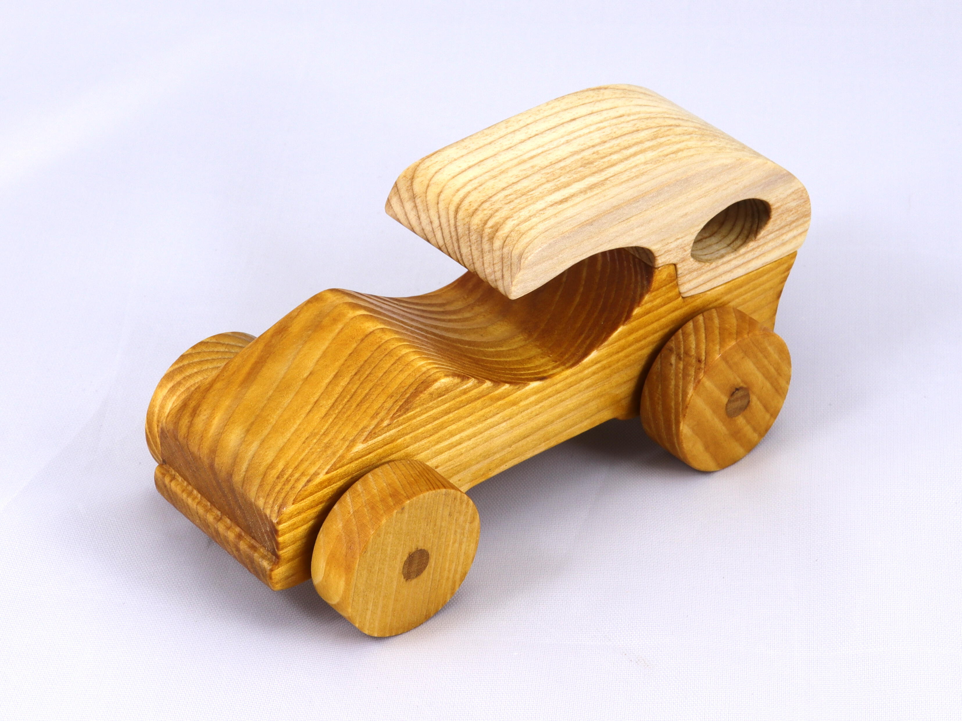 Handmade wooden toy car finished with nontoxic clear, amber shellac and contrasting wood trim. It's one of ten cars in my Speedy Wheels Collection.