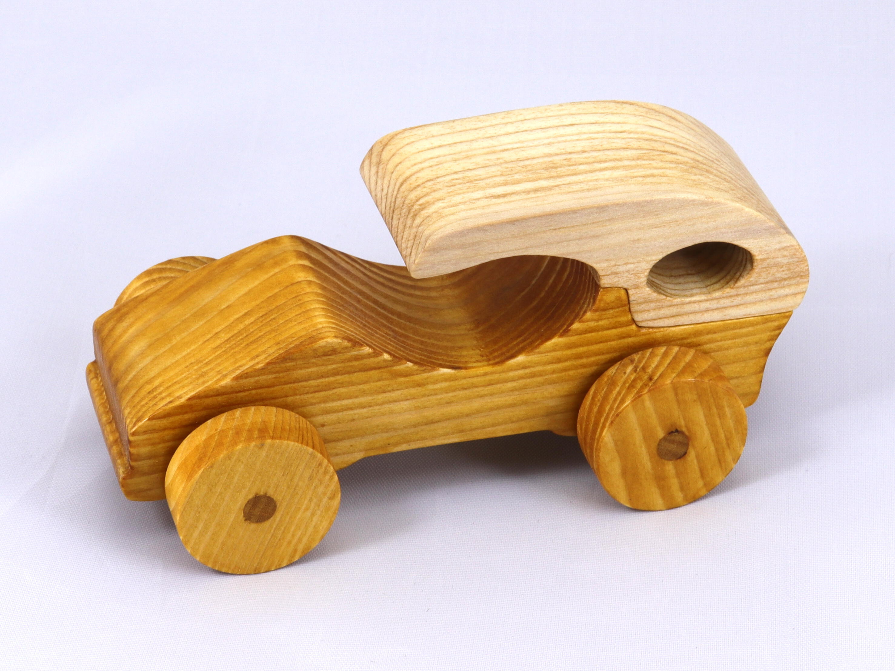 Handmade wooden toy car finished with nontoxic clear, amber shellac and contrasting wood trim. It's one of ten cars in my Speedy Wheels Collection.