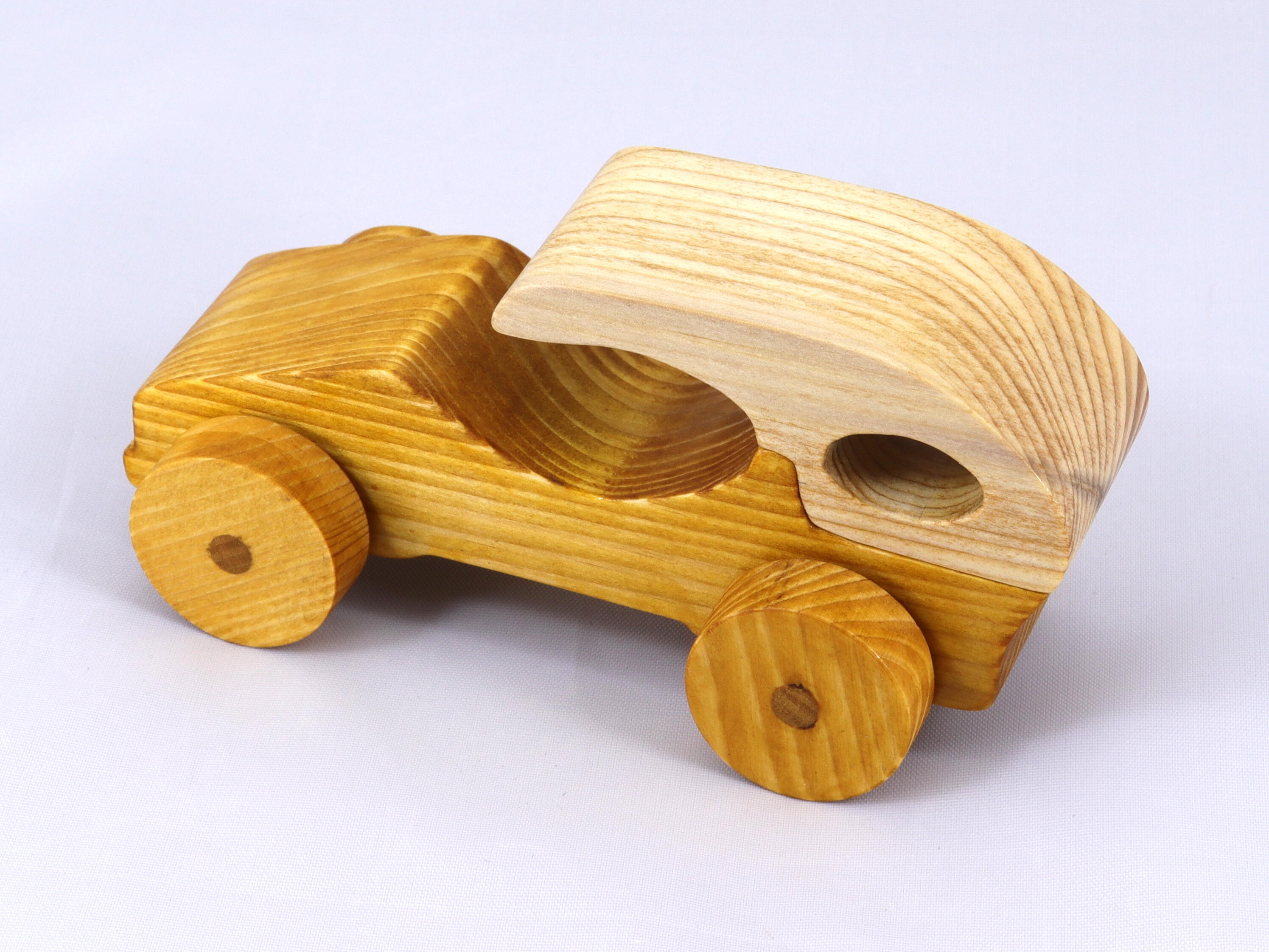 Handmade wooden toy car finished with nontoxic clear, amber shellac and contrasting wood trim. It's one of ten cars in my Speedy Wheels Collection.