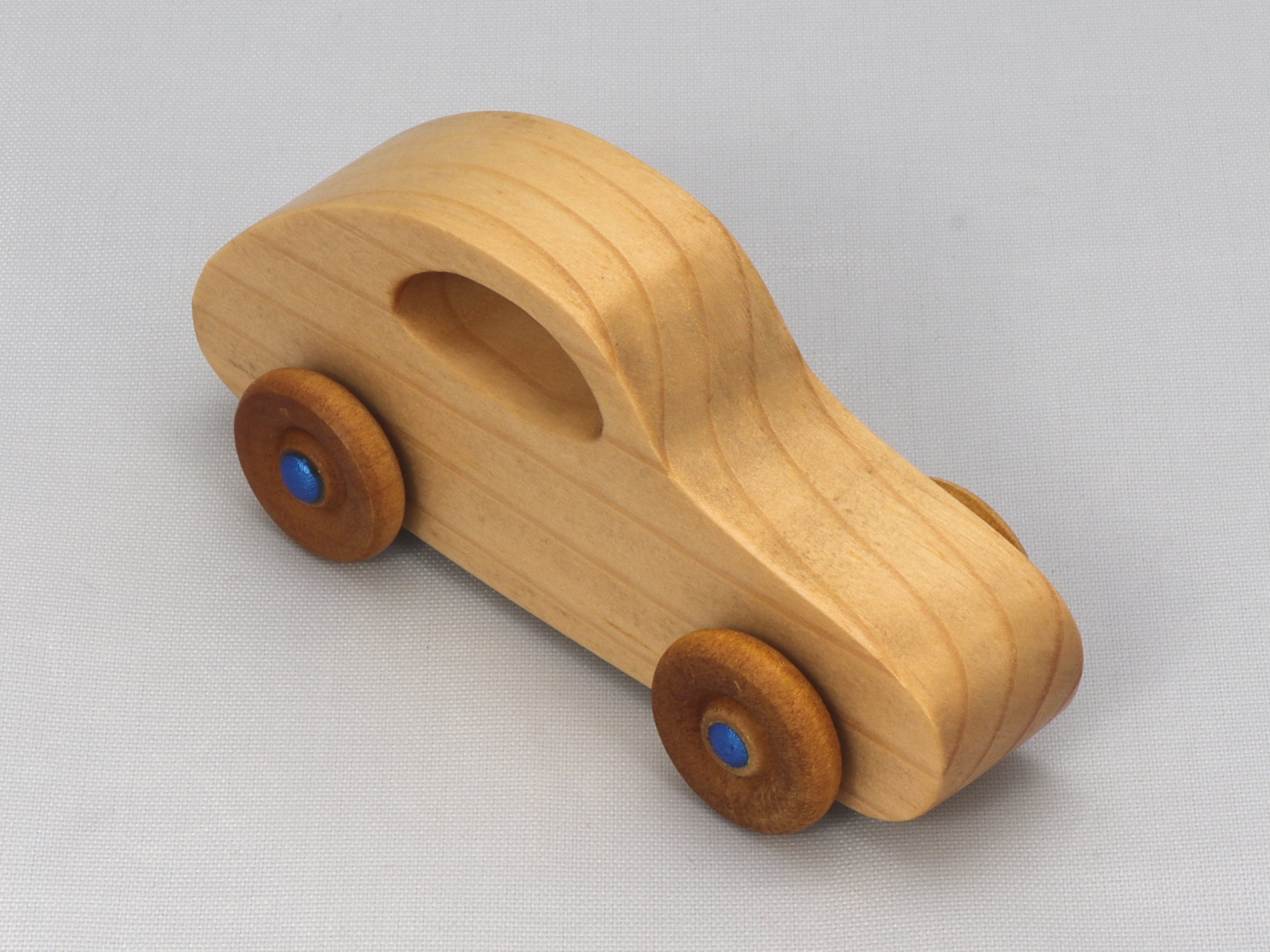 Handmade Wood Toy Car Hand Finished With Clear And Amber Shellac And Trimmed With Metallic Saphire Blue Acrylic Paint