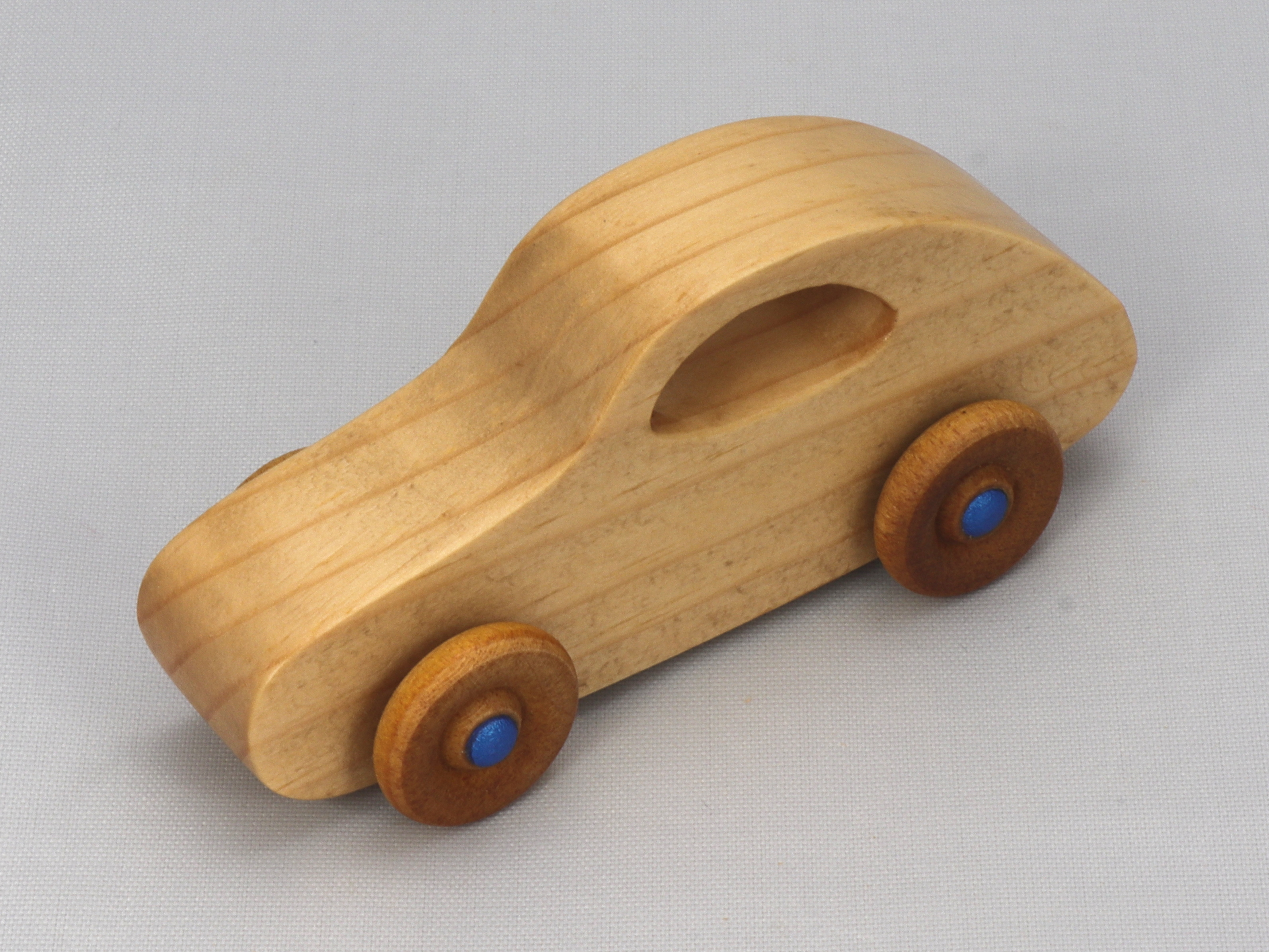 Handmade Wood Toy Car Hand Finished With Clear And Amber Shellac And Trimmed With Metallic Saphire Blue Acrylic Paint