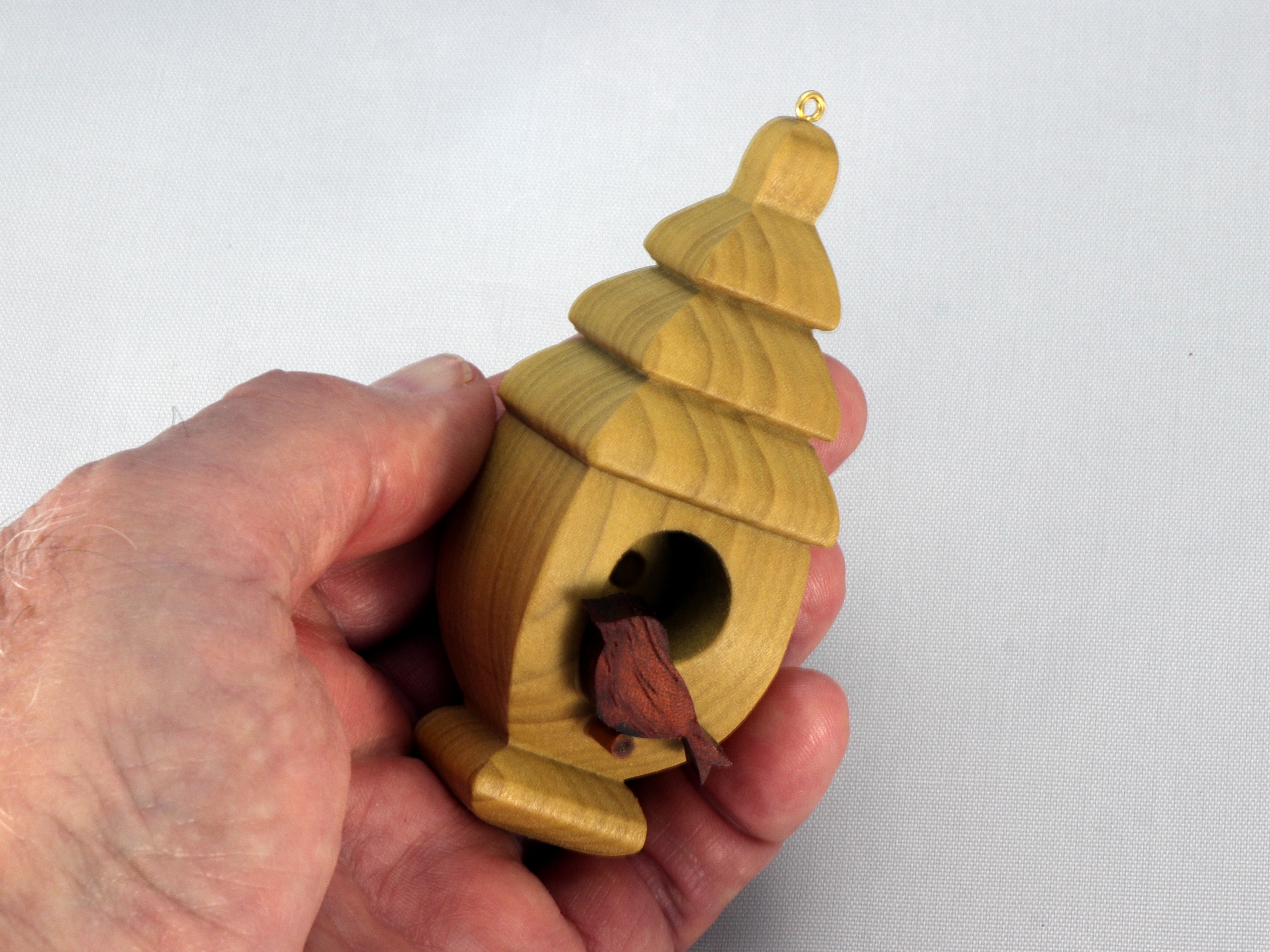 Handmade Wood Birdhouse Ornament Collectable Christmas Tree Ornament shapeed like a Christmas tree. Made from select-grade hardwoods, hand-sanded, and finished with a custom blend of oils and waxes using traditional woodworking tools.