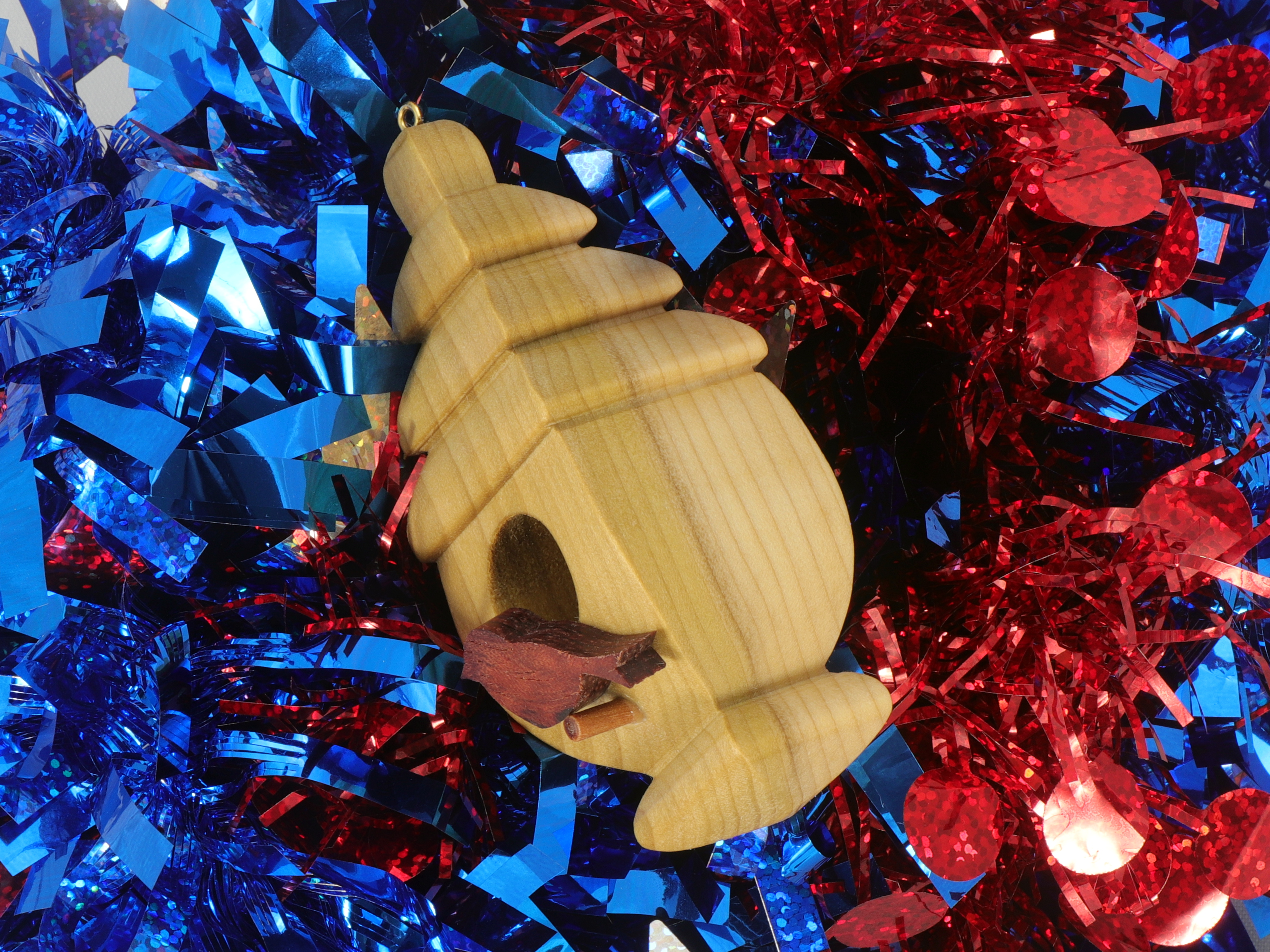 Handmade Wood Birdhouse Ornament Collectable Christmas Tree Ornament shapeed like a Christmas tree. Made from select-grade hardwoods, hand-sanded, and finished with a custom blend of oils and waxes using traditional woodworking tools.