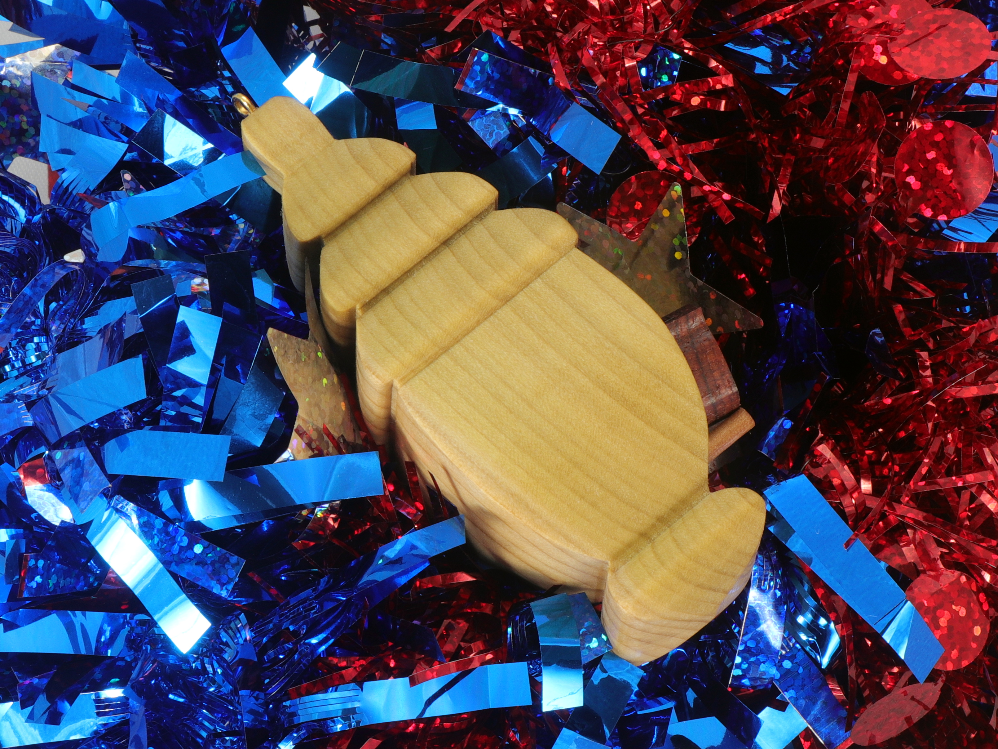 Handmade Wood Birdhouse Ornament Collectable Christmas Tree Ornament shapeed like a Christmas tree. Made from select-grade hardwoods, hand-sanded, and finished with a custom blend of oils and waxes using traditional woodworking tools.