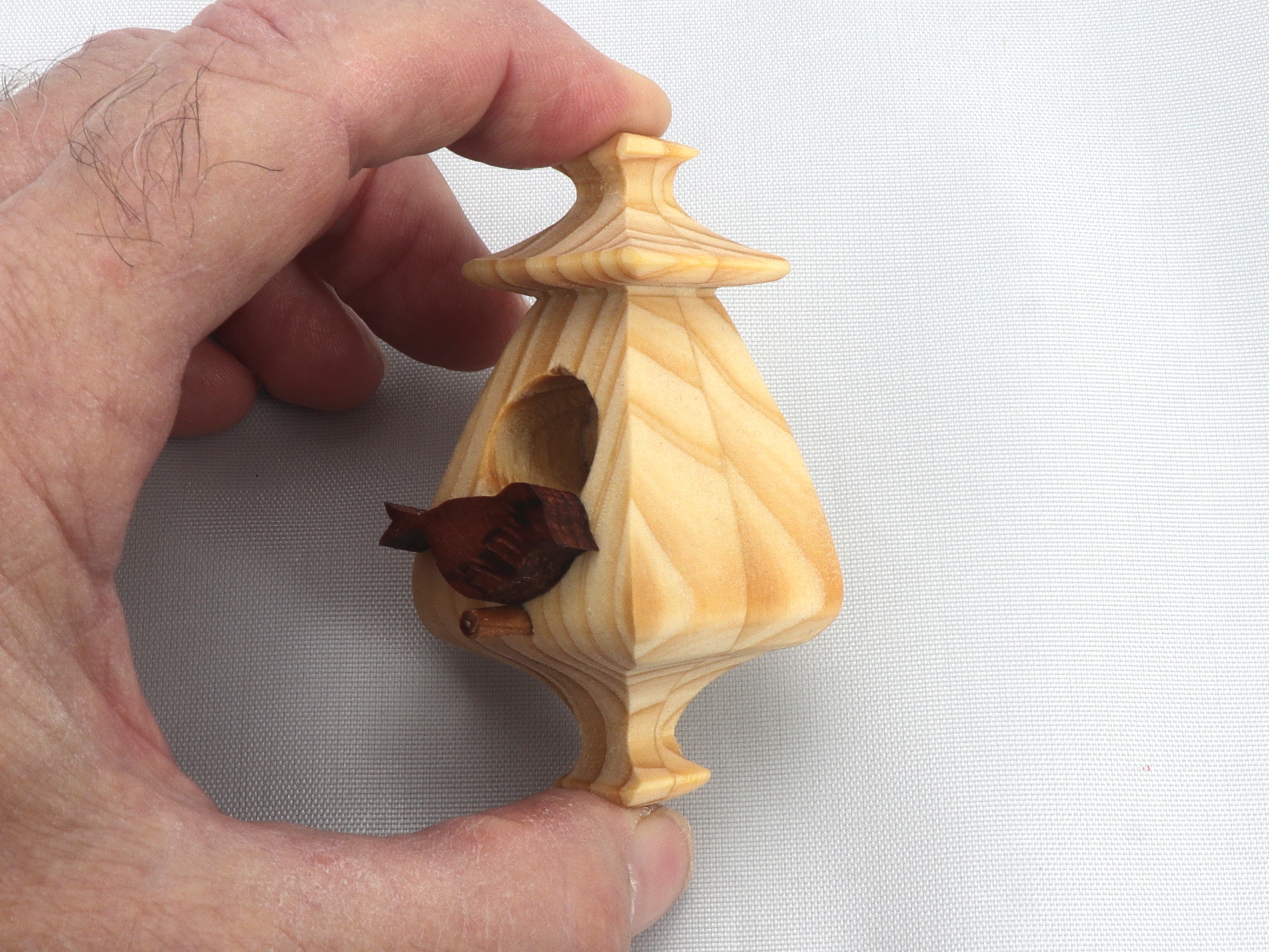 Handmade Wood Miniature Birdhouse Ornament crafted using only the finest select hardwoods and traditional woodworking tools. Each ornament is individually finished with a blend of mineral oil and beeswax to bring out the natural beauty of the wood.