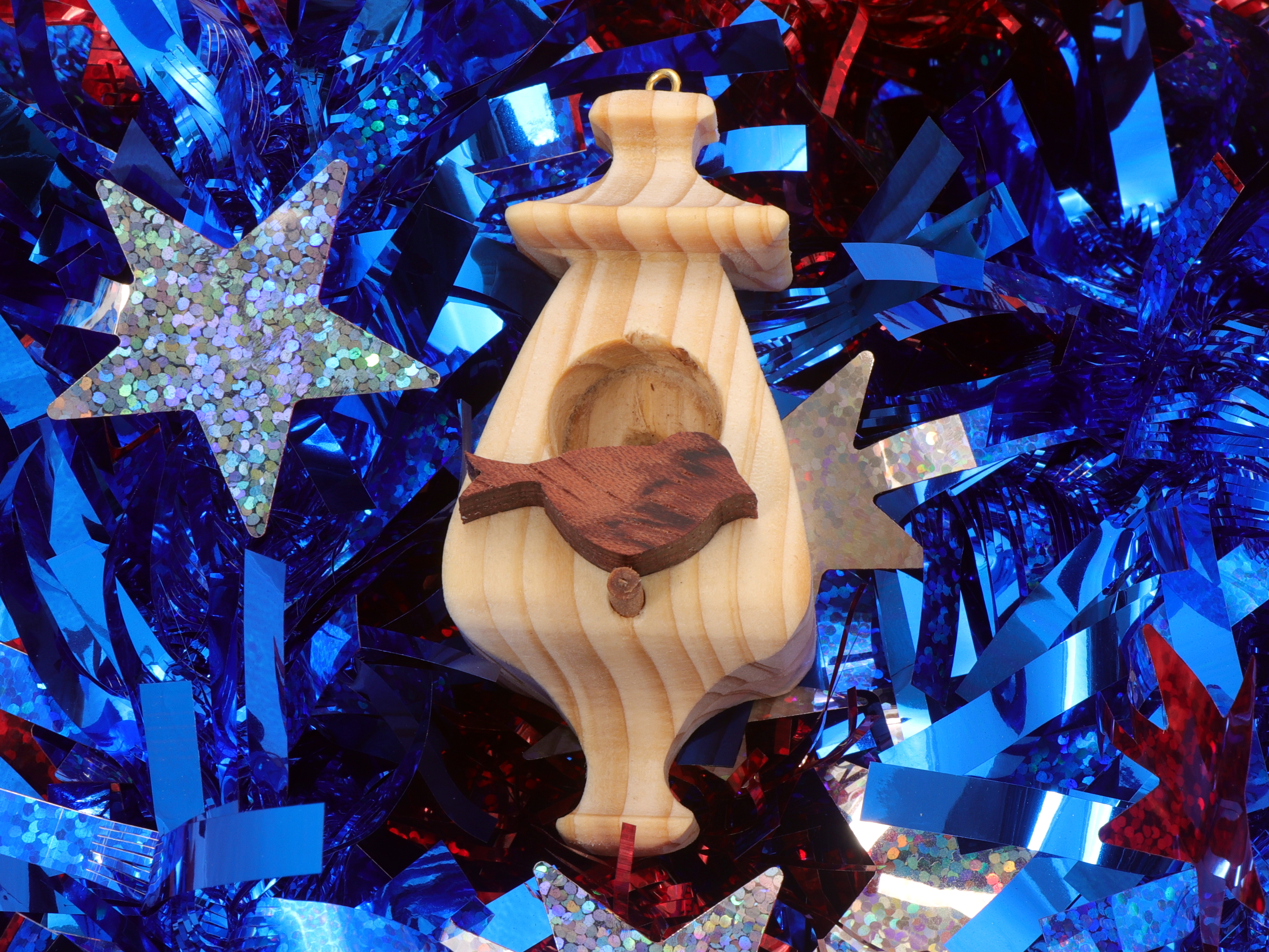 Handmade Wood Miniature Birdhouse Ornament crafted using only the finest select hardwoods and traditional woodworking tools. Each ornament is individually finished with a blend of mineral oil and beeswax to bring out the natural beauty of the wood.