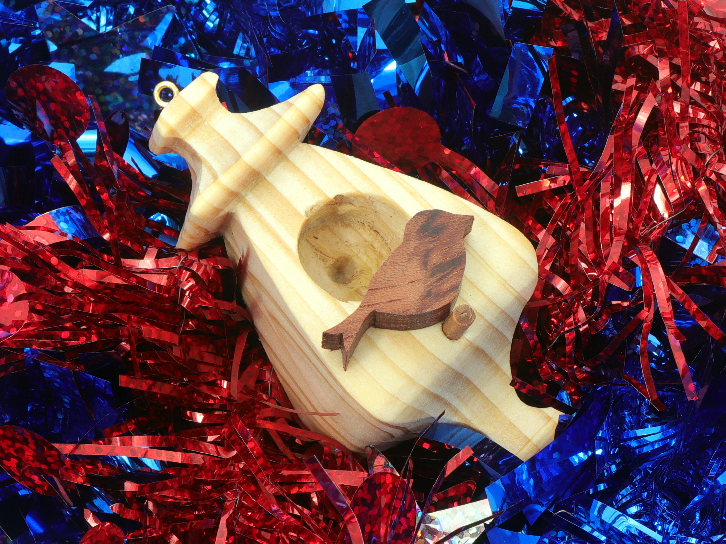 Handmade Wood Miniature Birdhouse Ornament crafted using only the finest select hardwoods and traditional woodworking tools. Each ornament is individually finished with a blend of mineral oil and beeswax to bring out the natural beauty of the wood.