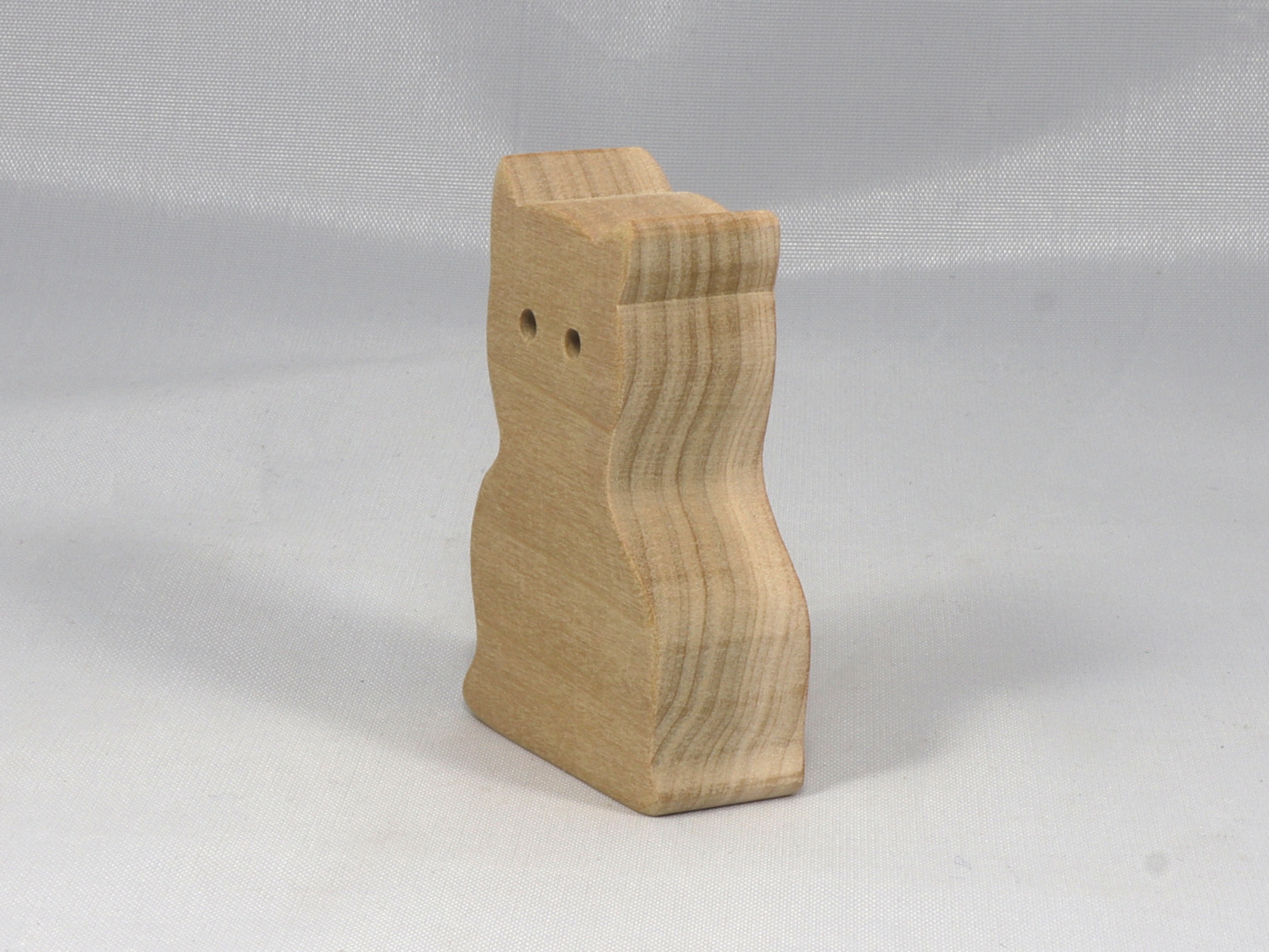 A handmade freestanding wooden toy cat cutout 1/2-3/4 inches thick is made from various kinds of wood sanded smooth and ready to paint. It is excellent for kids' crafts, pretend, or stacking toys. Other sizes are available with a custom order.