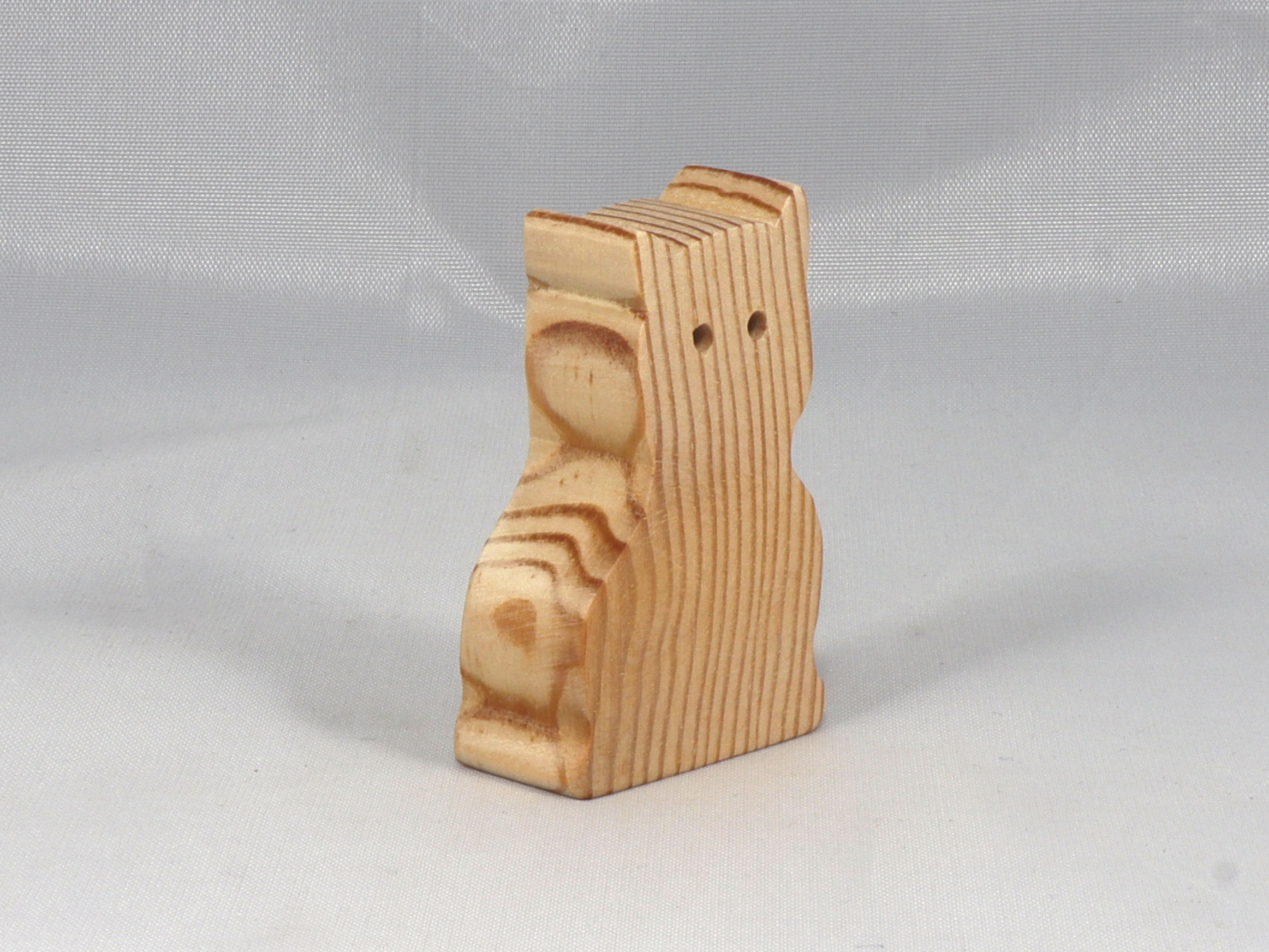 A handmade freestanding wooden toy cat cutout 1/2-3/4 inches thick is made from various kinds of wood sanded smooth and ready to paint. It is excellent for kids' crafts, pretend, or stacking toys. Other sizes are available with a custom order.