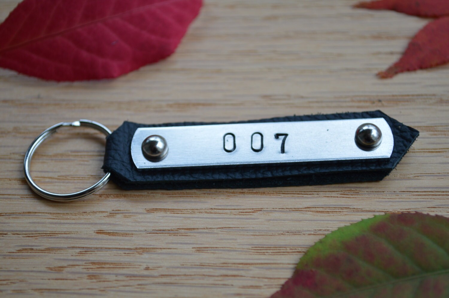 Products BOND, JAMES BOND hand stamped keychain. On aluminum using