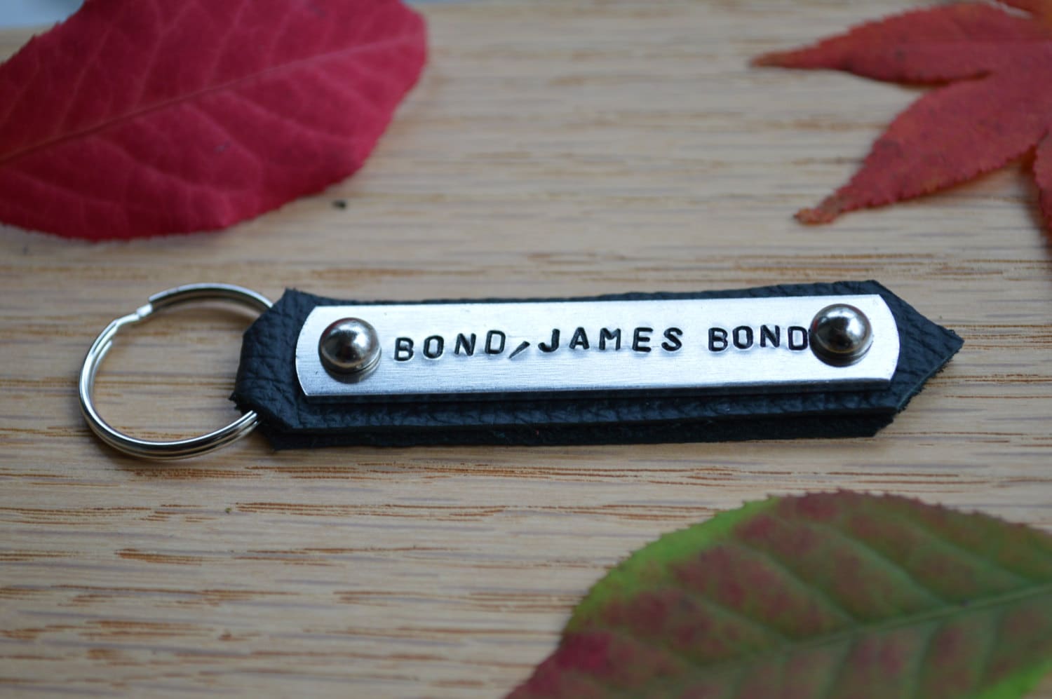 Products BOND, JAMES BOND hand stamped keychain. On aluminum using