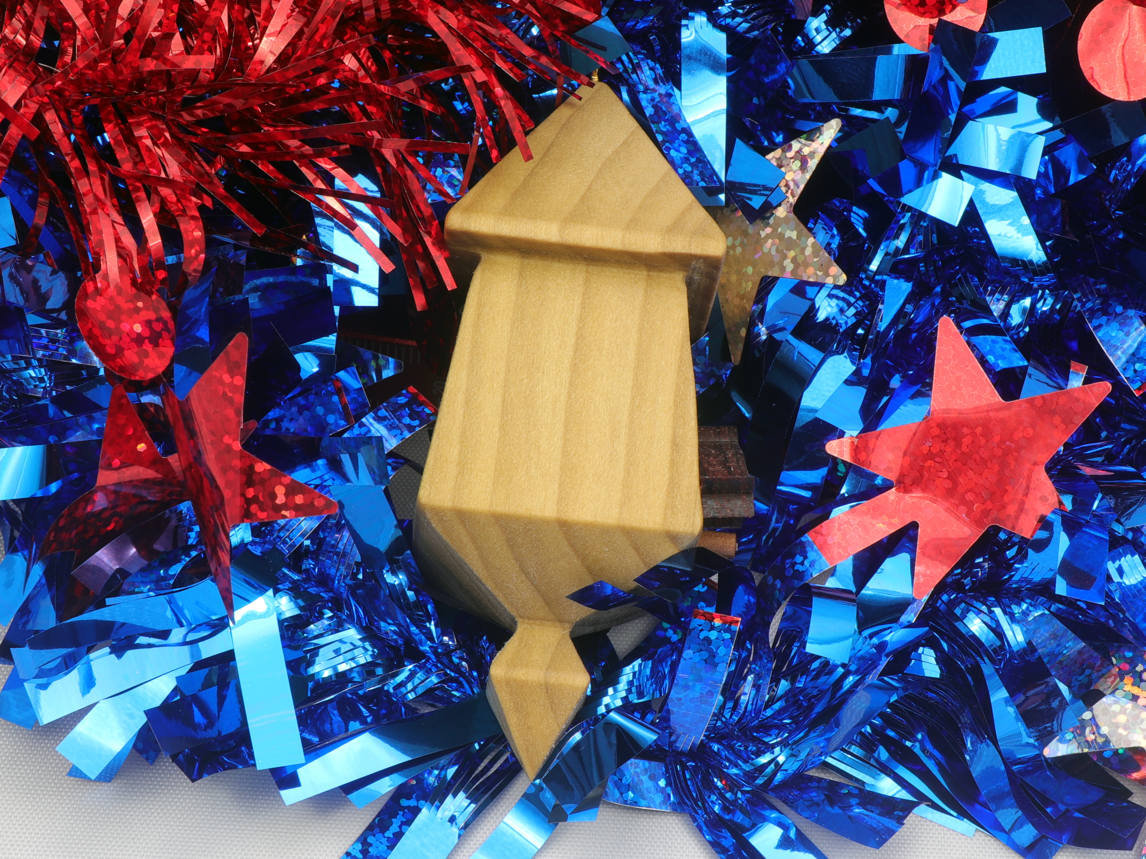 Handmade miniature birdhouse ornament crafted from select hardwoods, featuring a meticulous finish with a beeswax and oil blend—a collectible and charming decorative piece.