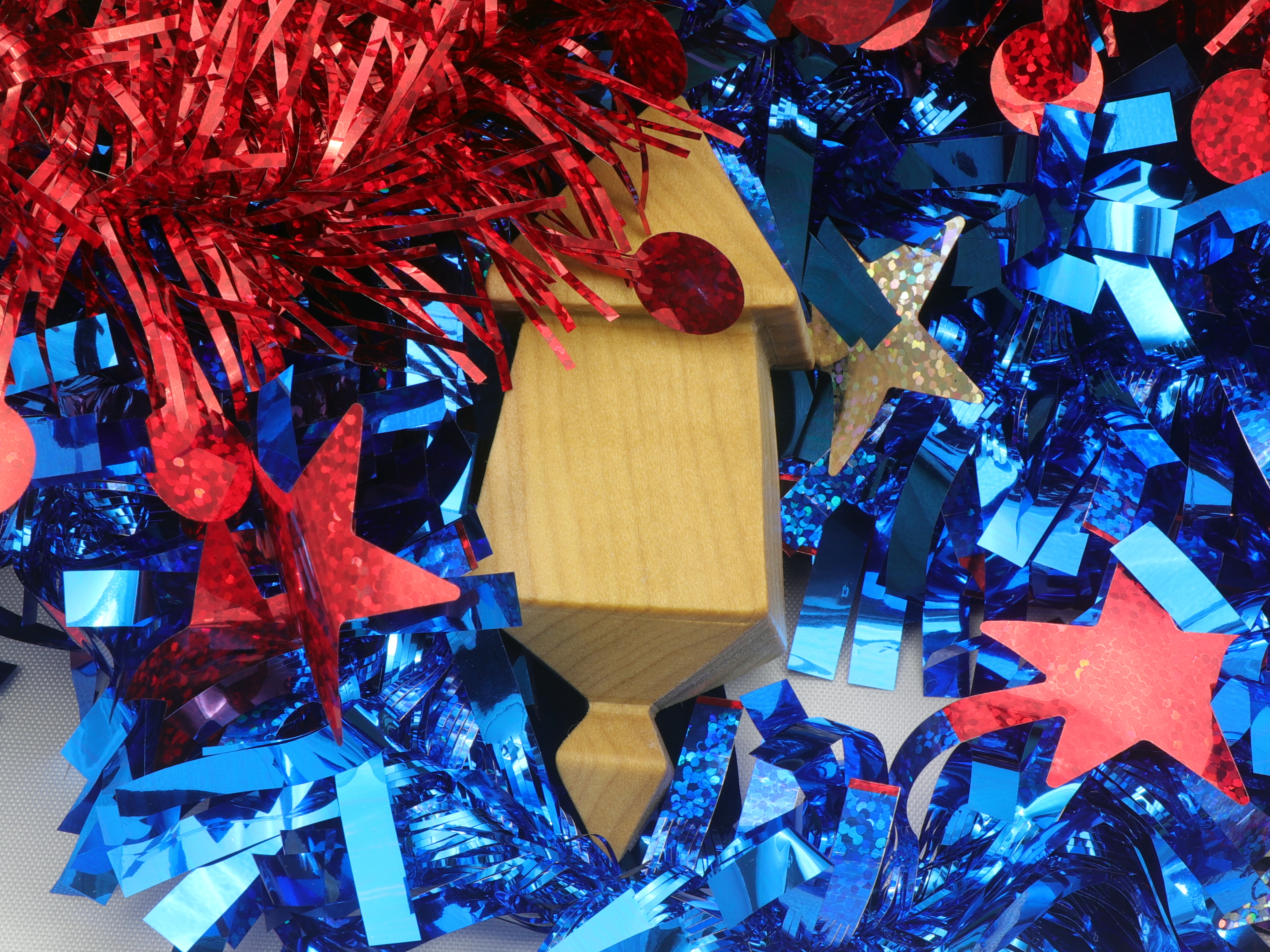 Handmade miniature birdhouse ornament crafted from select hardwoods, featuring a meticulous finish with a beeswax and oil blend—a collectible and charming decorative piece.