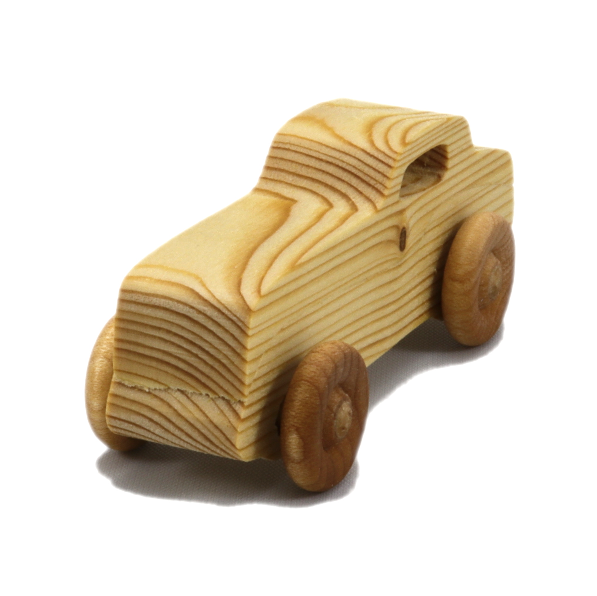 Handmade wooden toy car finished with mineral oil and beeswax, for kids aged three and up.