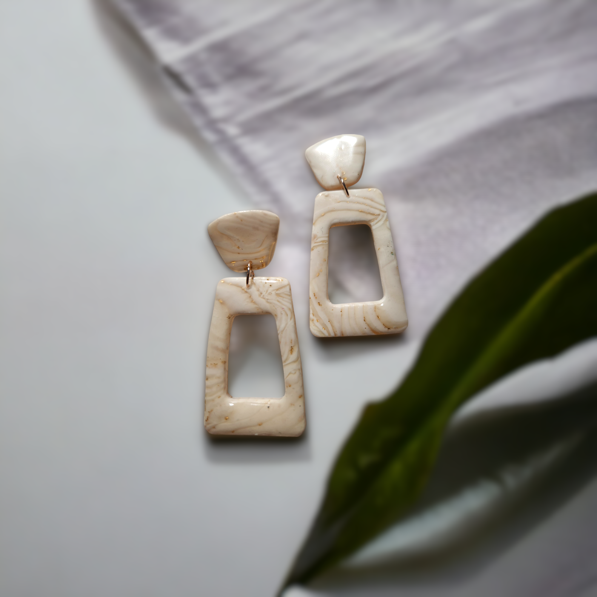 I made these earrings with polymer clay, uv resin and acrylic gold