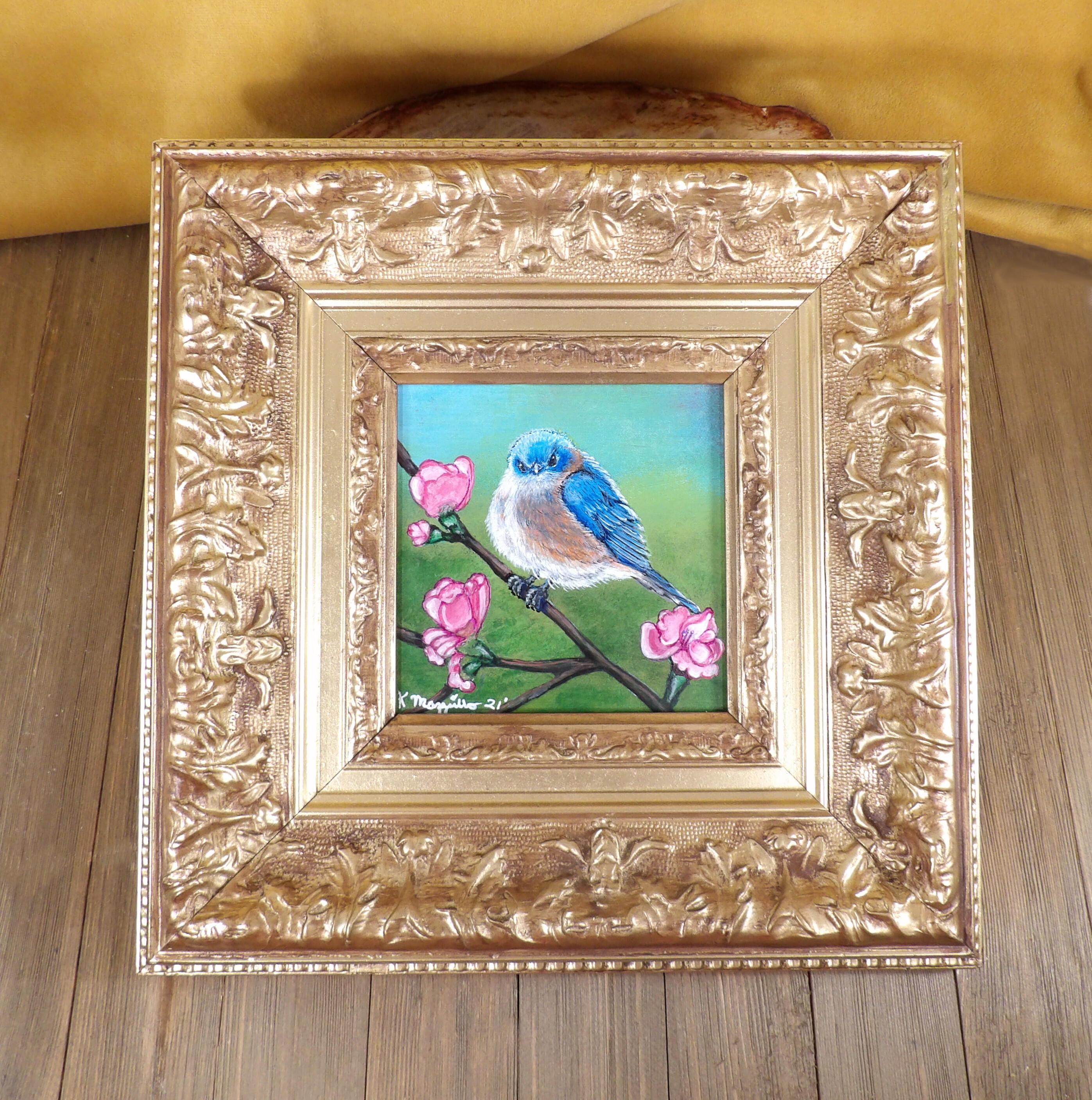 Framed blue bird painting